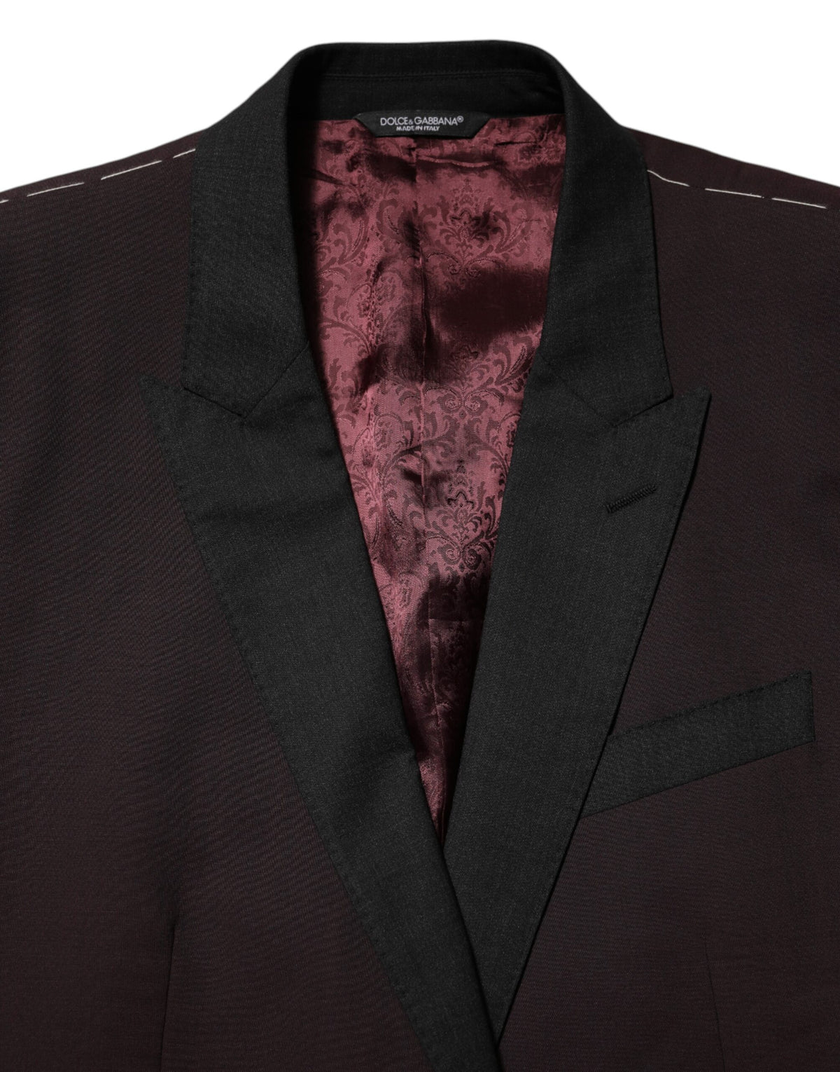 Experience the allure of Dolce & Gabbana's Maroon Wool Blazer, a masterpiece of Italian craftsmanship that embodies sophistication and elegance for the discerning individual.