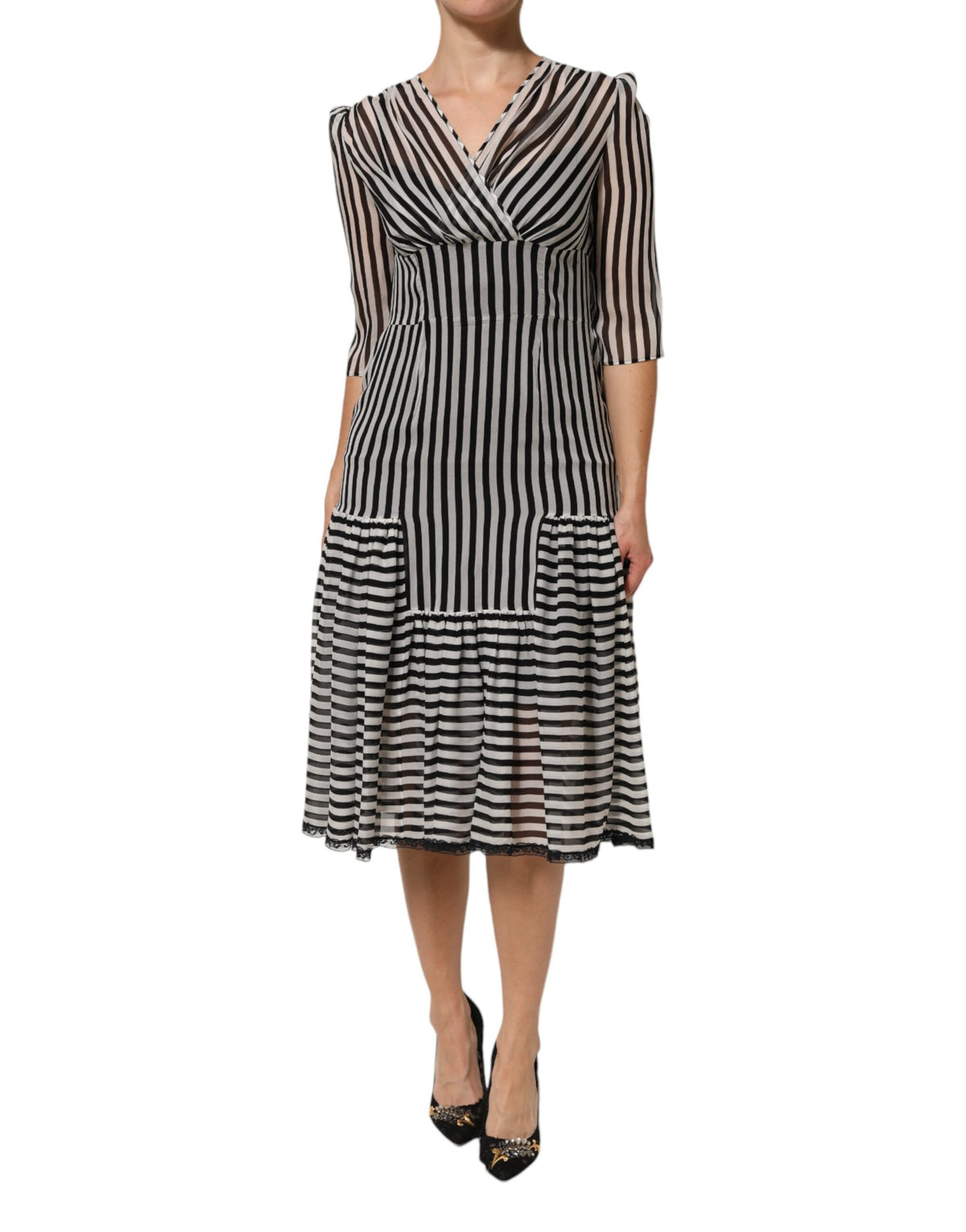 Elevate your wardrobe with the Dolce & Gabbana Black White Stripes Silk V-neck Midi Dress, a timeless embodiment of luxury and sophistication, crafted in Italy.