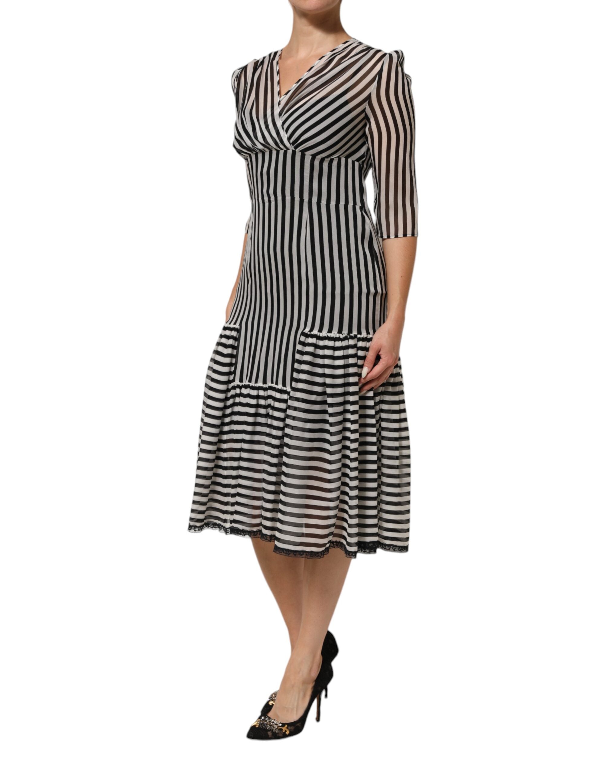 Experience the allure of Dolce & Gabbana's Black White Stripes Silk V-neck Midi Dress, where exquisite craftsmanship and luxurious silk embody timeless elegance for the discerning individual.