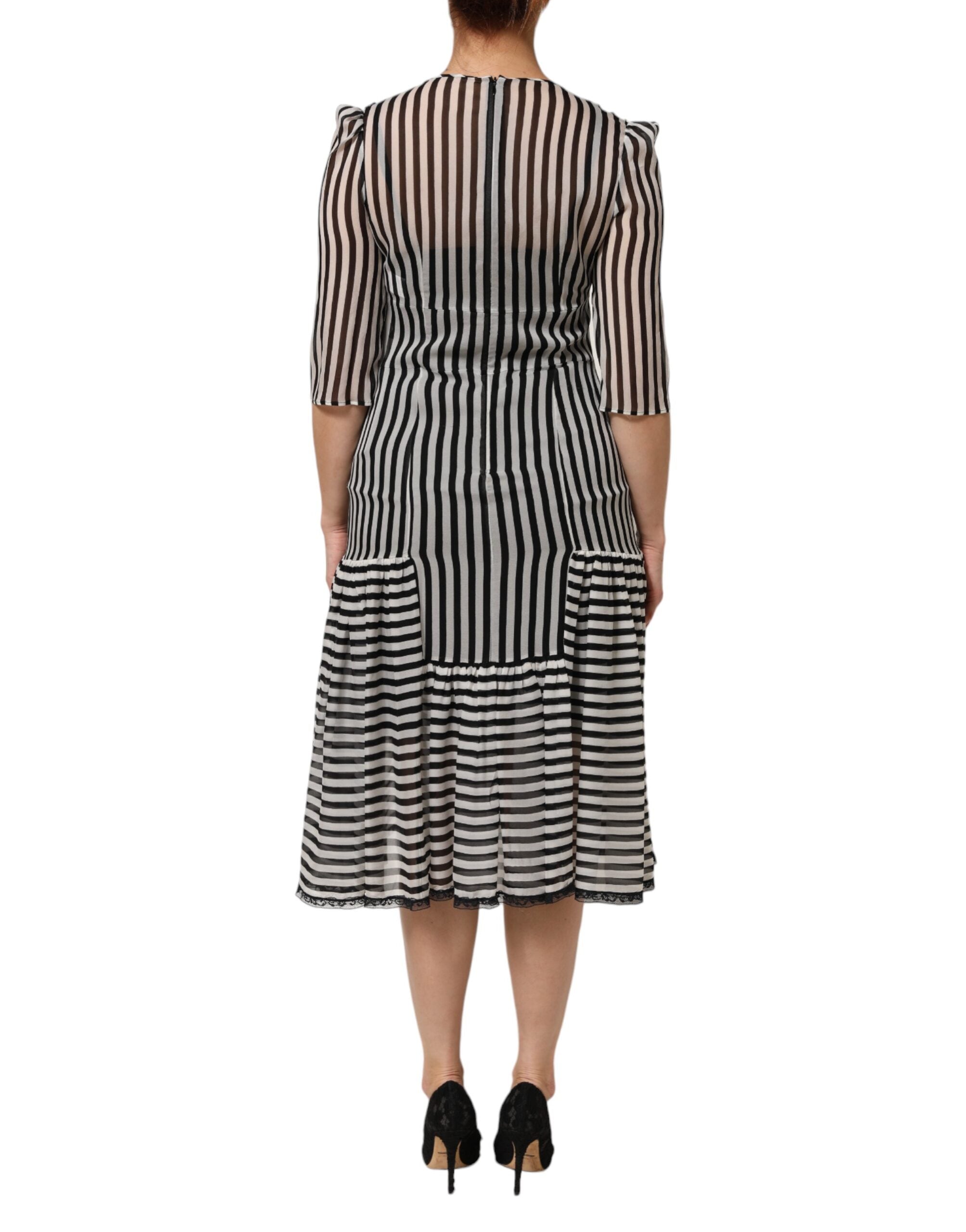 Experience the allure of the Dolce & Gabbana Black White Stripes Silk V-neck Midi Dress, a timeless piece of exquisite craftsmanship that embodies luxury and sophistication.