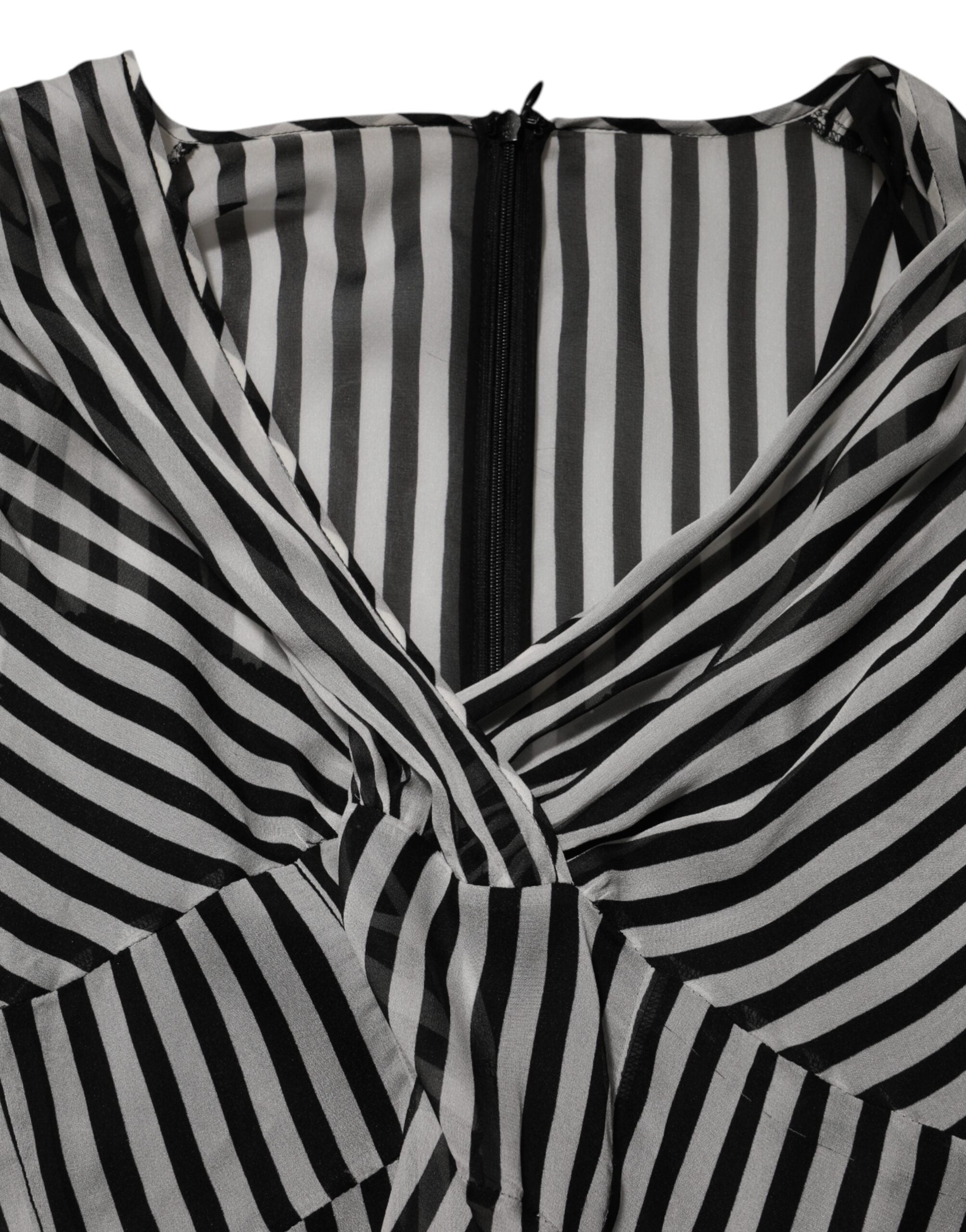 Experience the allure of Dolce & Gabbana's Black White Stripes Silk V-neck Midi Dress, a timeless masterpiece of Italian craftsmanship that embodies luxury and sophistication.