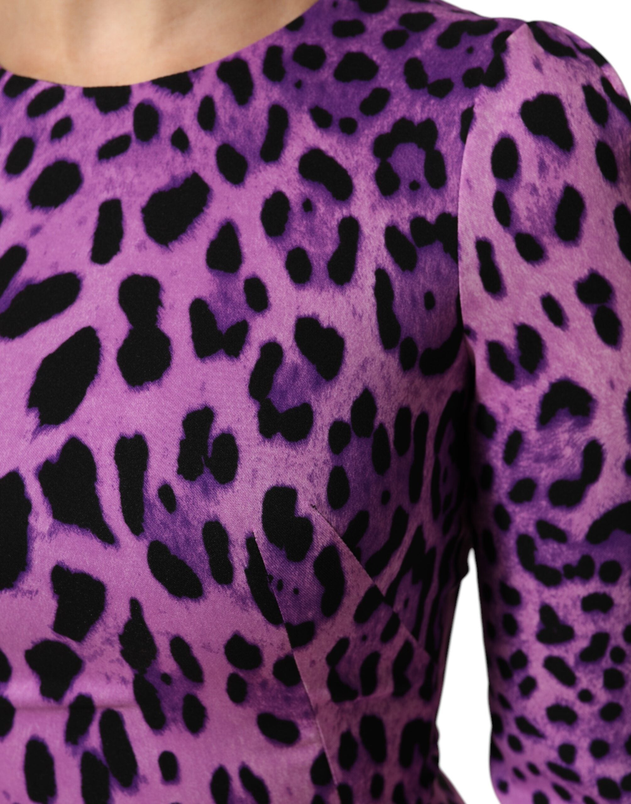 Indulge in the allure of the Dolce & Gabbana Violet Leopard Sheath Bodycon Mini Dress, a masterpiece of silk and elastane that embodies Italian elegance and exquisite craftsmanship.