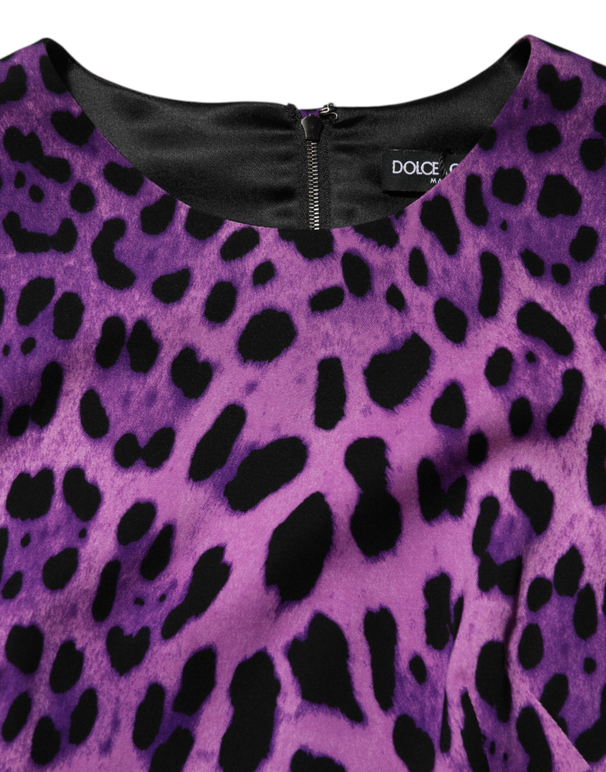 Indulge in the Dolce & Gabbana Violet Leopard Sheath Bodycon Mini Dress, a luxurious blend of silk and elastane, epitomizing exquisite Italian craftsmanship and timeless elegance.