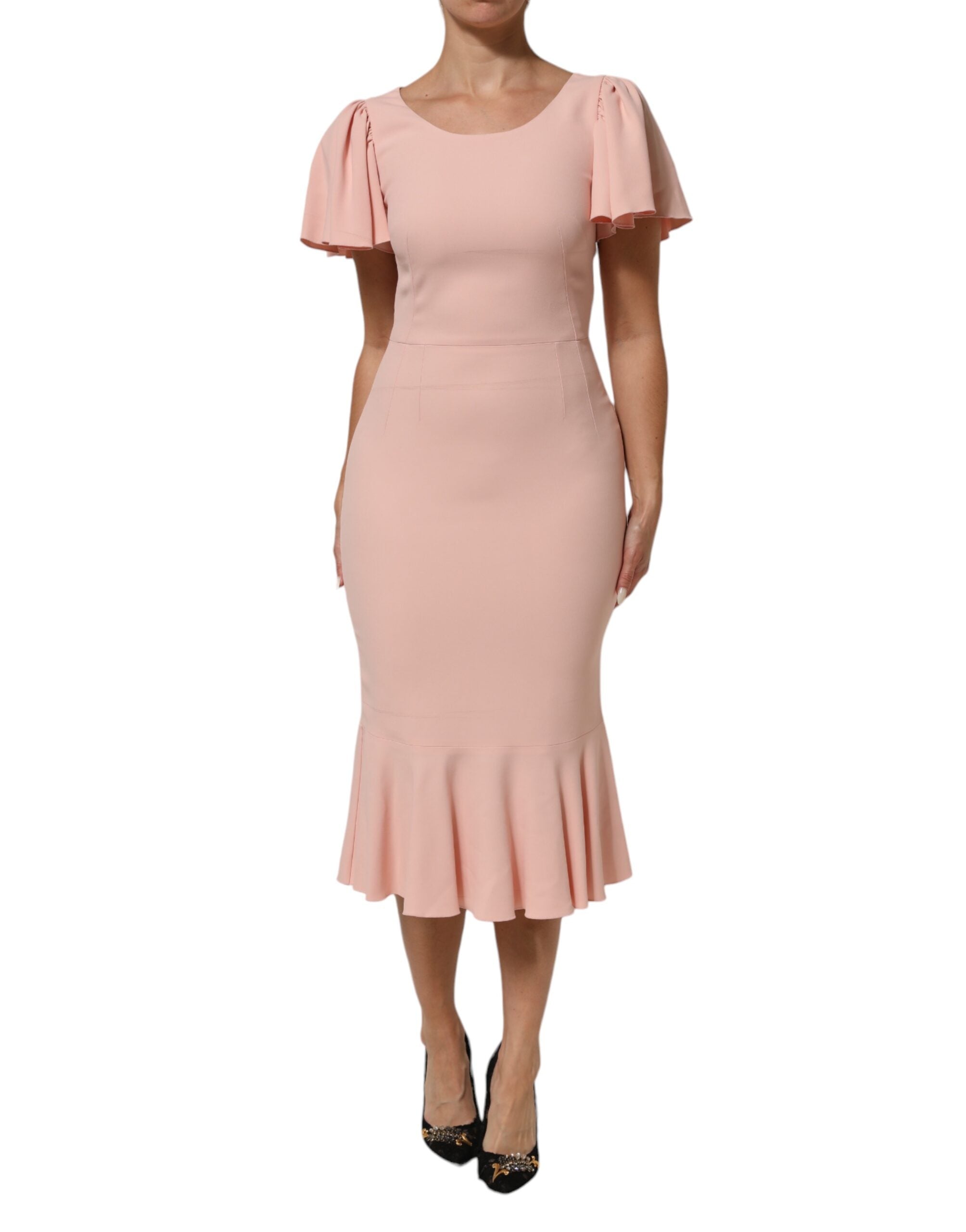 Indulge in the exquisite allure of the Dolce & Gabbana Pink Viscose Fit Flared Sheath Midi Dress, a timeless masterpiece of Italian craftsmanship that embodies luxury and sophistication.