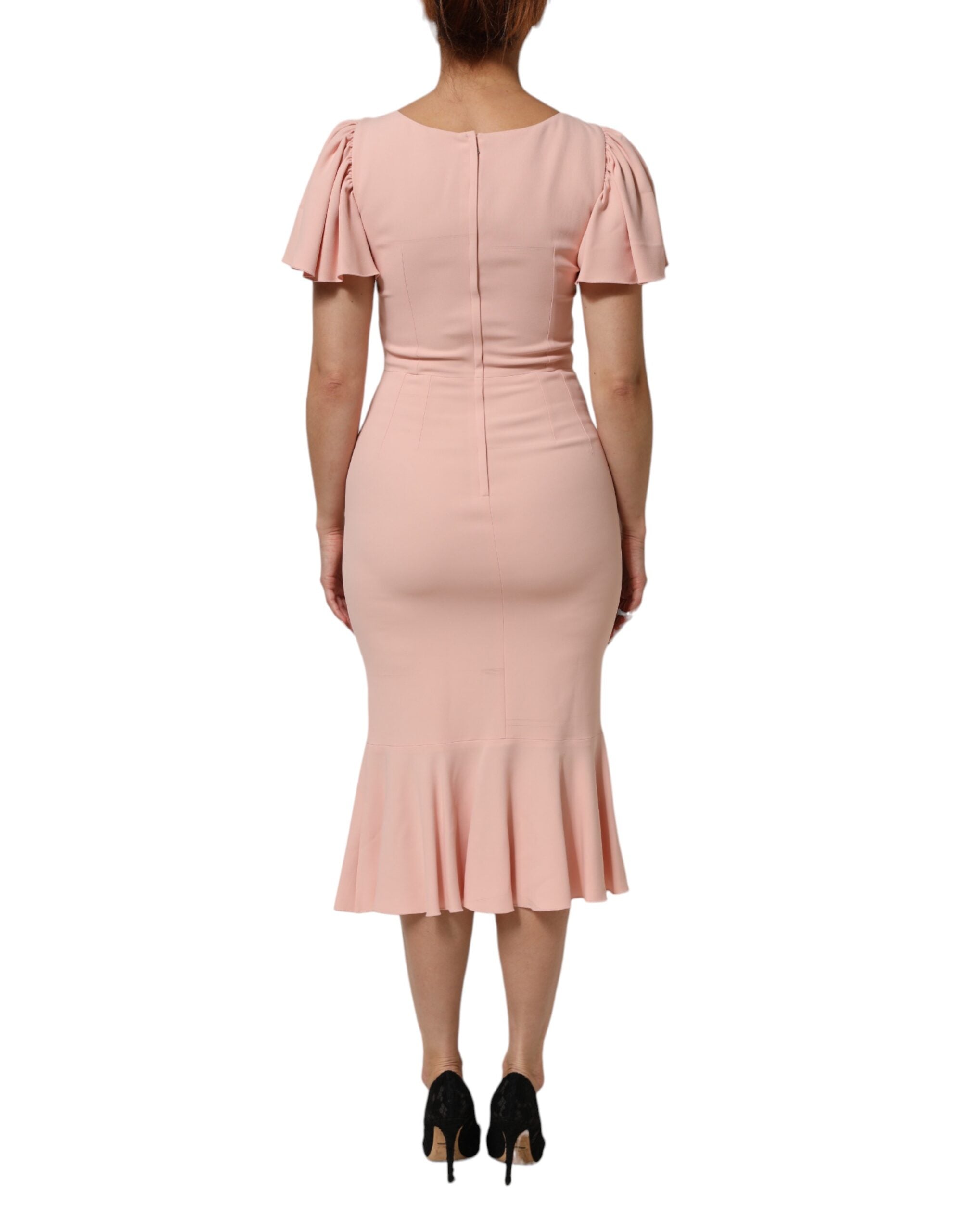 Indulge in the exquisite allure of the Dolce & Gabbana Pink Viscose Fit Flared Sheath Midi Dress, a masterpiece of Italian craftsmanship that embodies timeless elegance and sophistication.