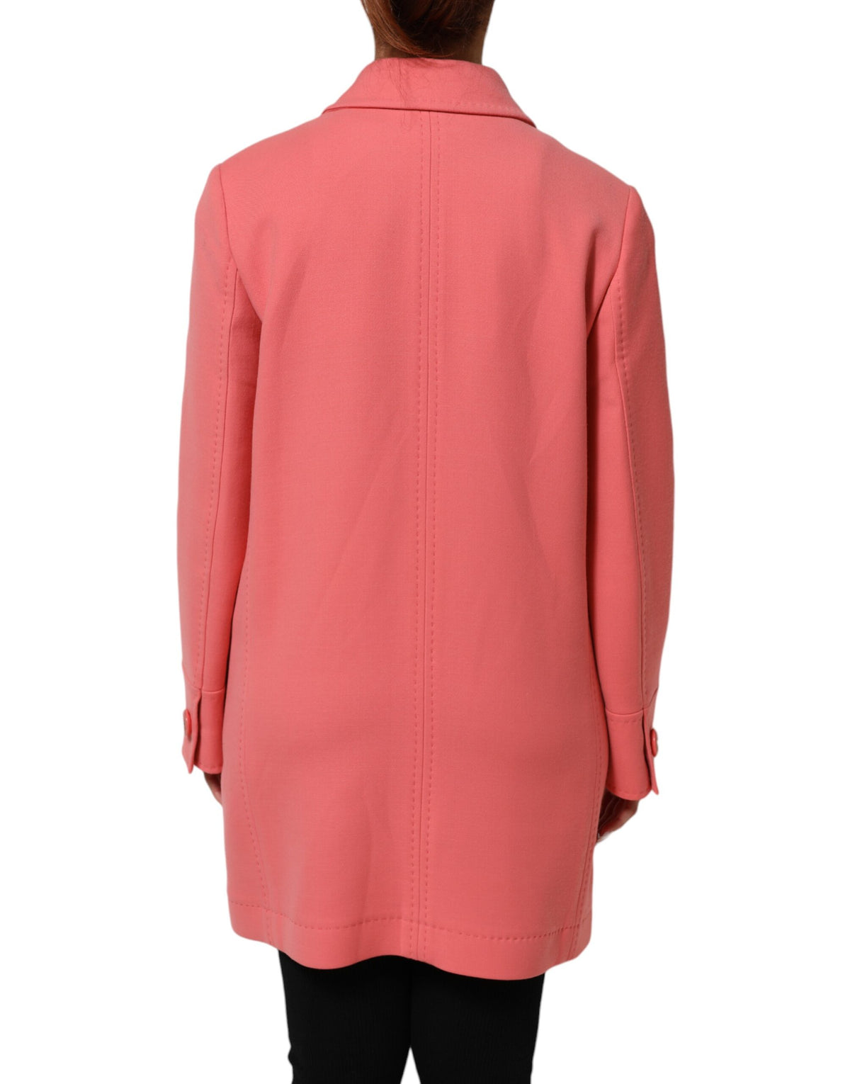 Experience the allure of the Dolce & Gabbana Pink Buttoned Down Trench Coat, a masterpiece in luxurious wool blend, epitomizing refined elegance and Italian craftsmanship.