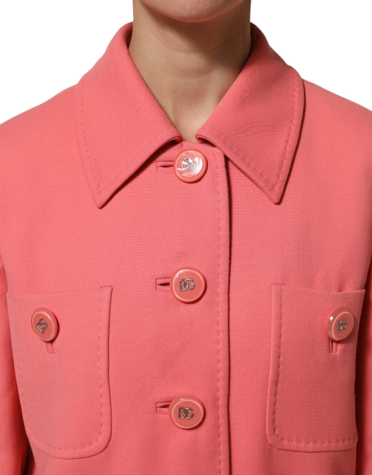Experience the allure of the Dolce & Gabbana Pink Buttoned Down Trench Coat, a masterpiece of Italian craftsmanship in a luxurious wool blend, perfect for the discerning fashion connoisseur.
