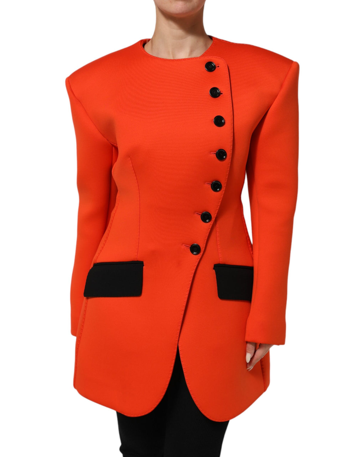 Elevate your wardrobe with the Dolce & Gabbana Red Buttoned Down Trench Coat, a masterpiece of Italian craftsmanship that embodies timeless luxury and sophisticated allure.
