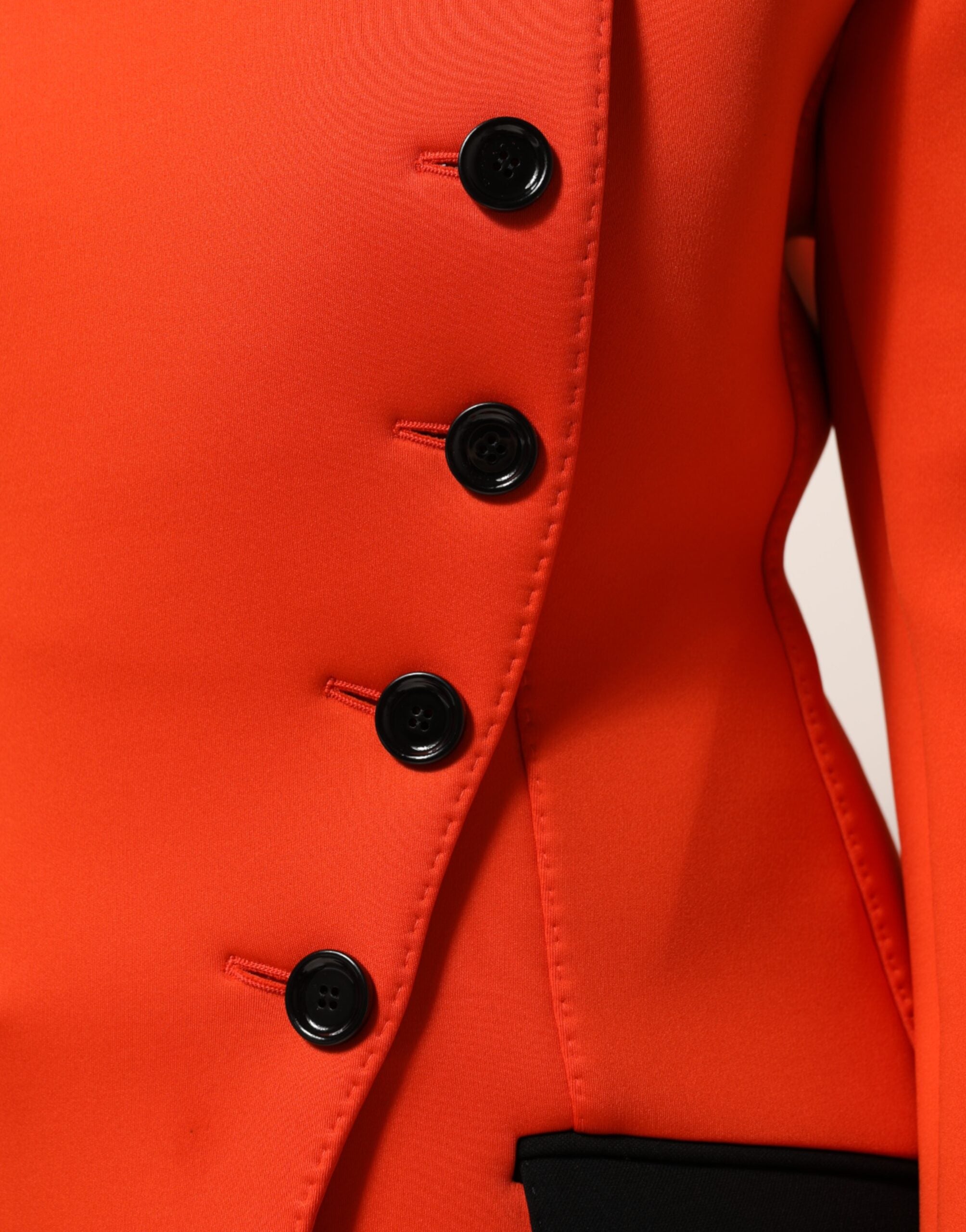 Indulge in the allure of the Dolce & Gabbana Red Buttoned Down Trench Coat, a masterpiece of Italian craftsmanship, blending timeless elegance with contemporary sophistication.