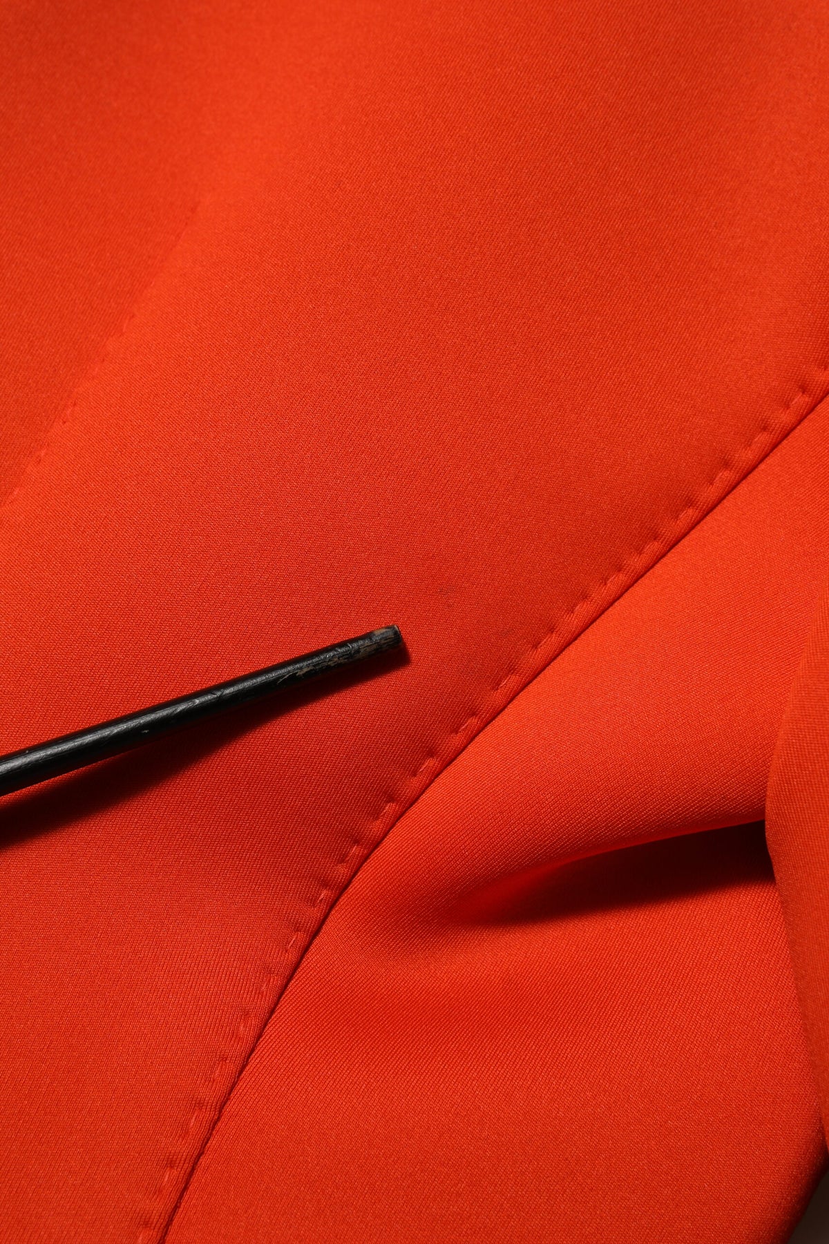 Indulge in the exquisite Dolce & Gabbana Red Buttoned Down Trench Coat, a masterpiece of Italian craftsmanship that elevates your style with timeless elegance and vibrant allure.