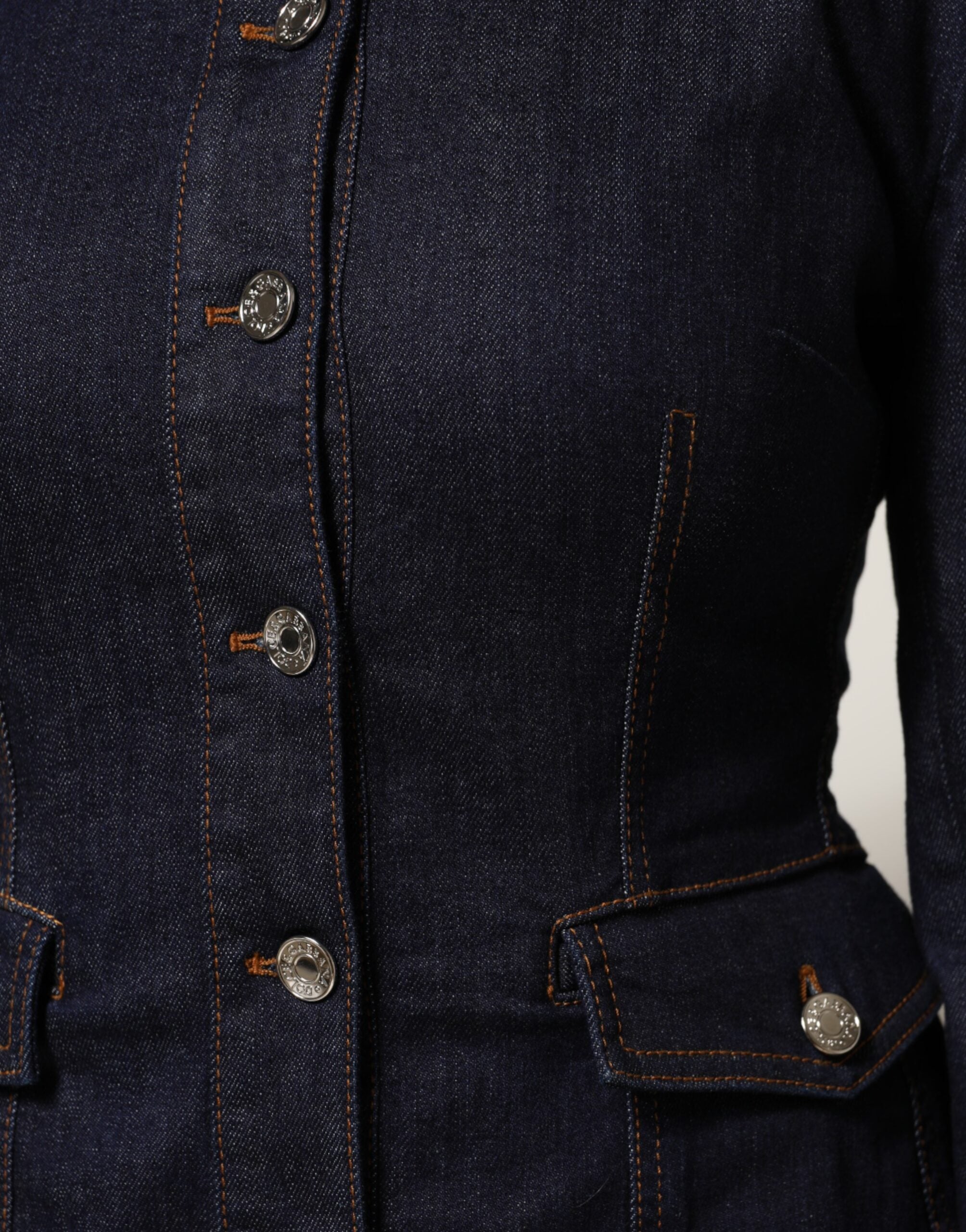 Elevate your wardrobe with the Dolce & Gabbana Dark Blue Cotton Collared Denim Coat Jacket, a masterpiece of Italian craftsmanship that embodies sophistication and timeless elegance.