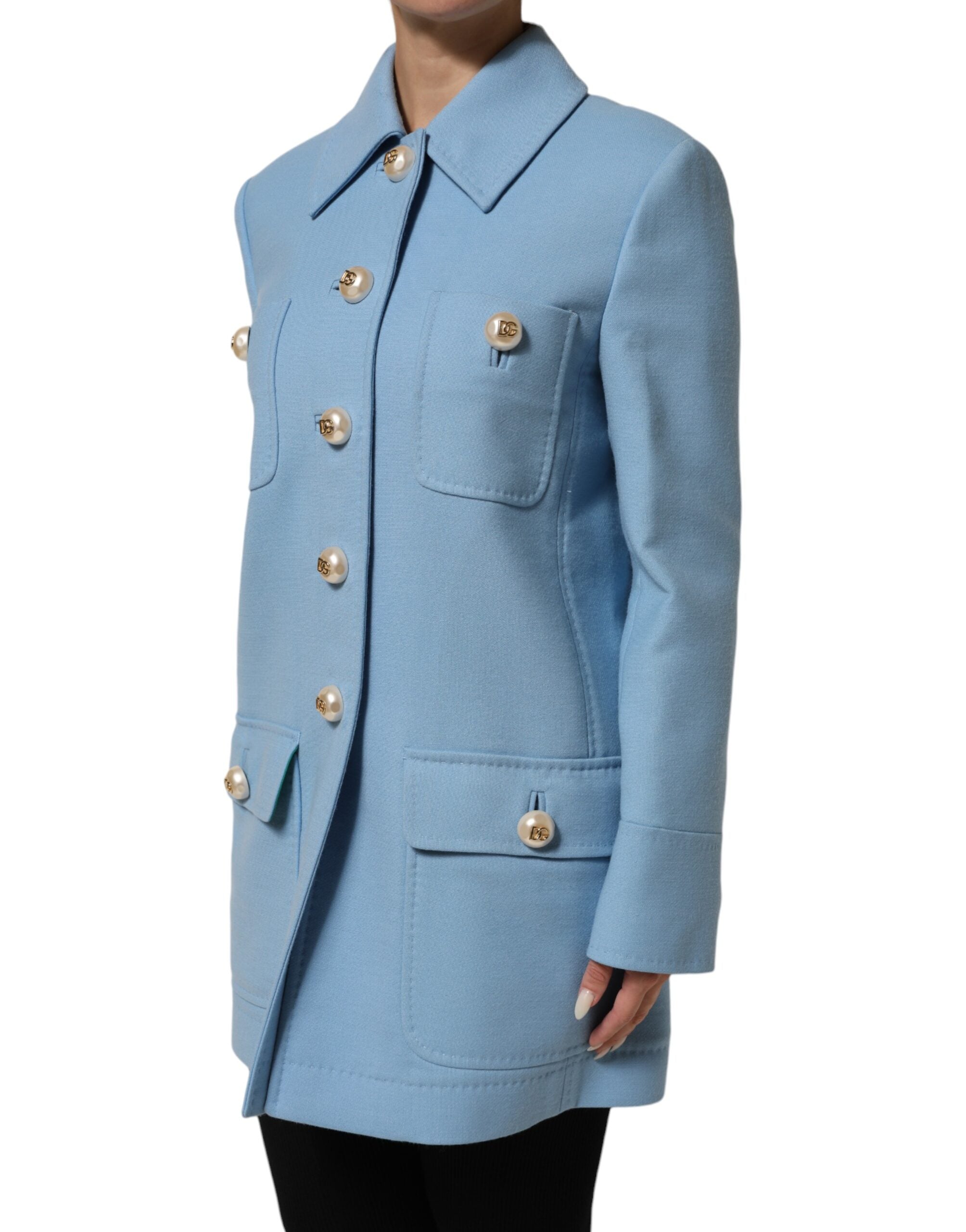 Discover the Dolce & Gabbana Blue Buttoned Down Trench Coat, a masterpiece of 100% wool and viscose lining, embodying timeless elegance and Italian craftsmanship for the discerning individual.