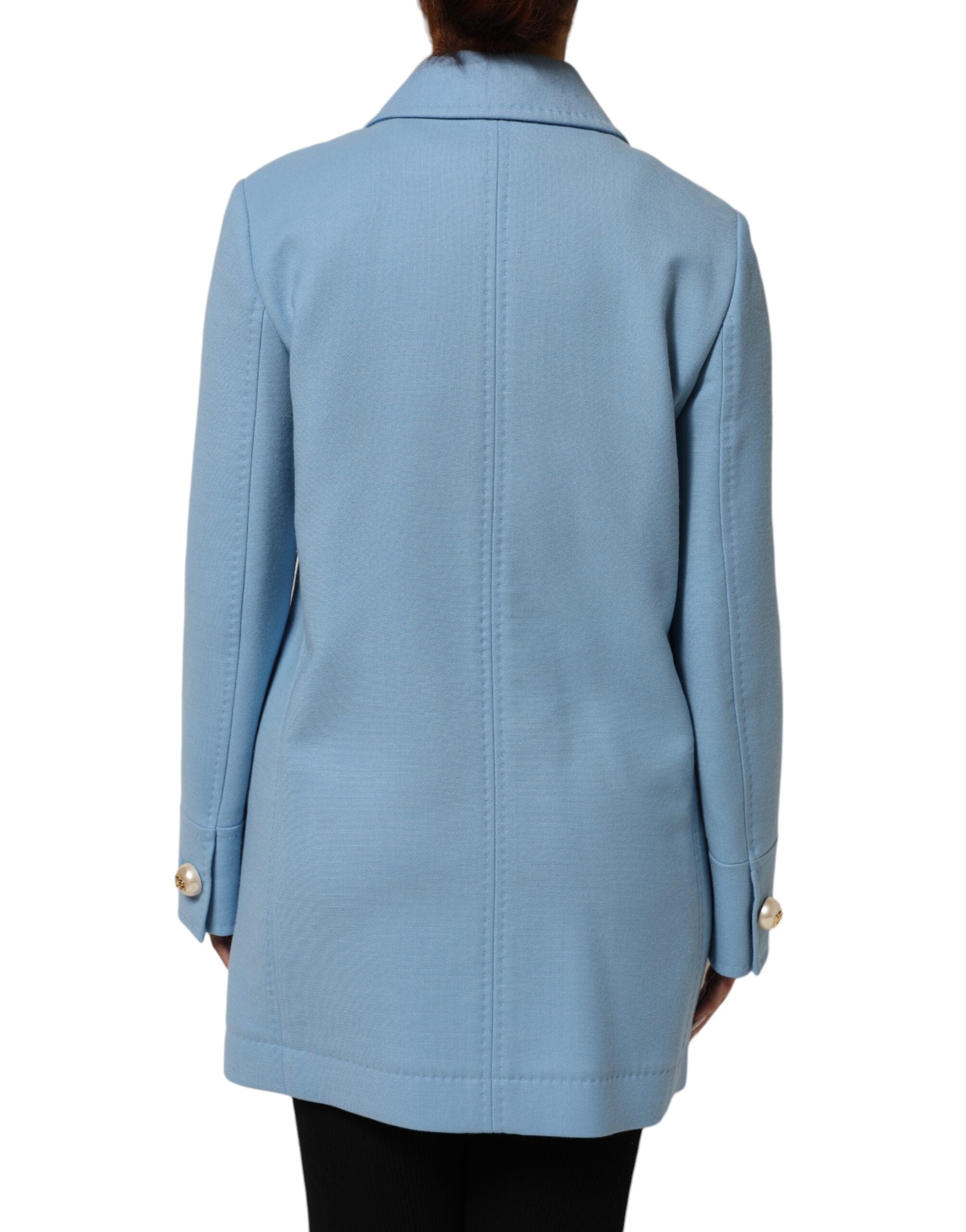 Experience the allure of the Dolce & Gabbana Blue Buttoned Down Trench Coat, a masterpiece of Italian craftsmanship in luxurious wool, perfect for the discerning individual.