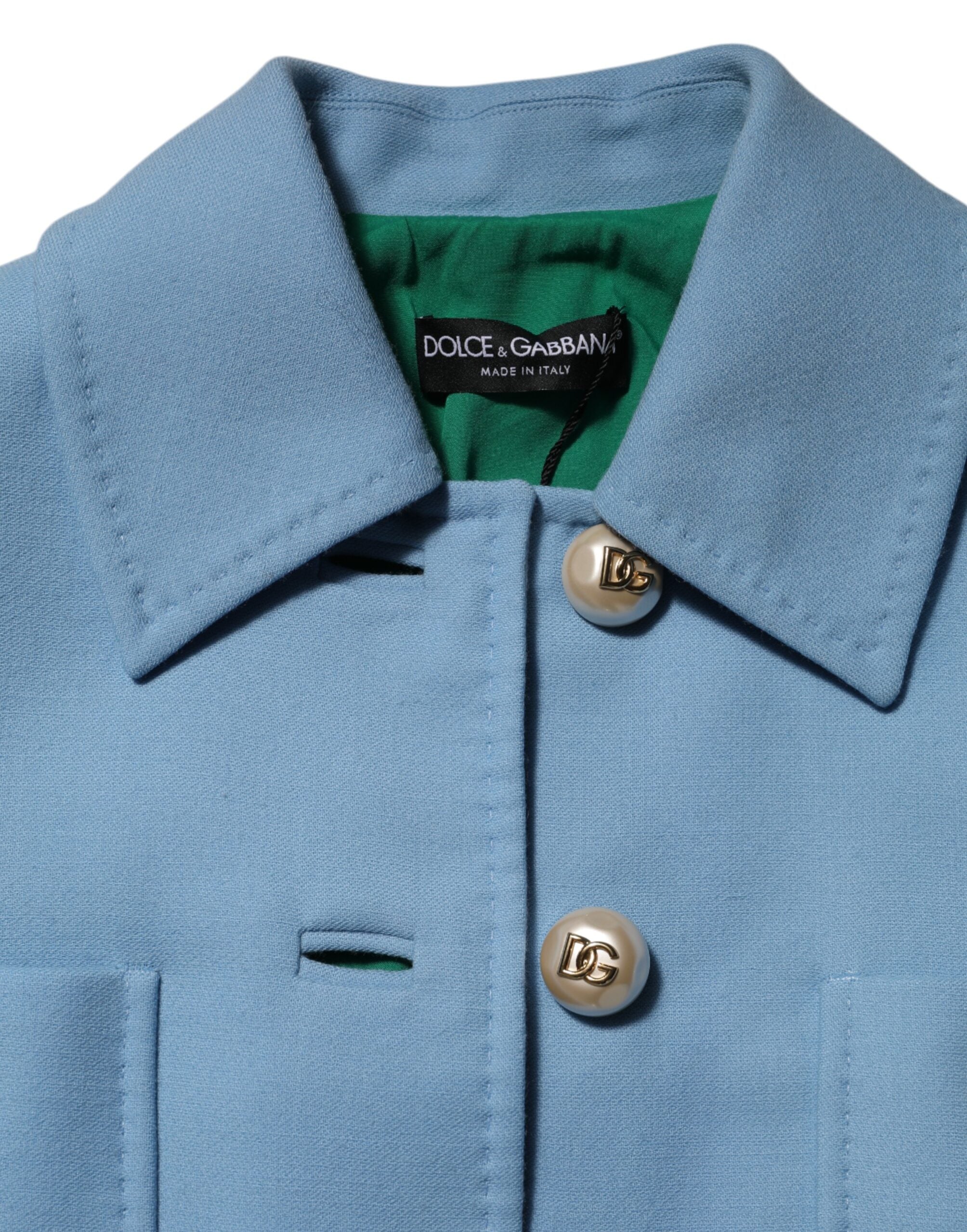 Elevate your style with the Dolce & Gabbana Blue Buttoned Down Trench Coat, a masterpiece of 100% wool and Italian craftsmanship, exuding timeless elegance and sophistication.
