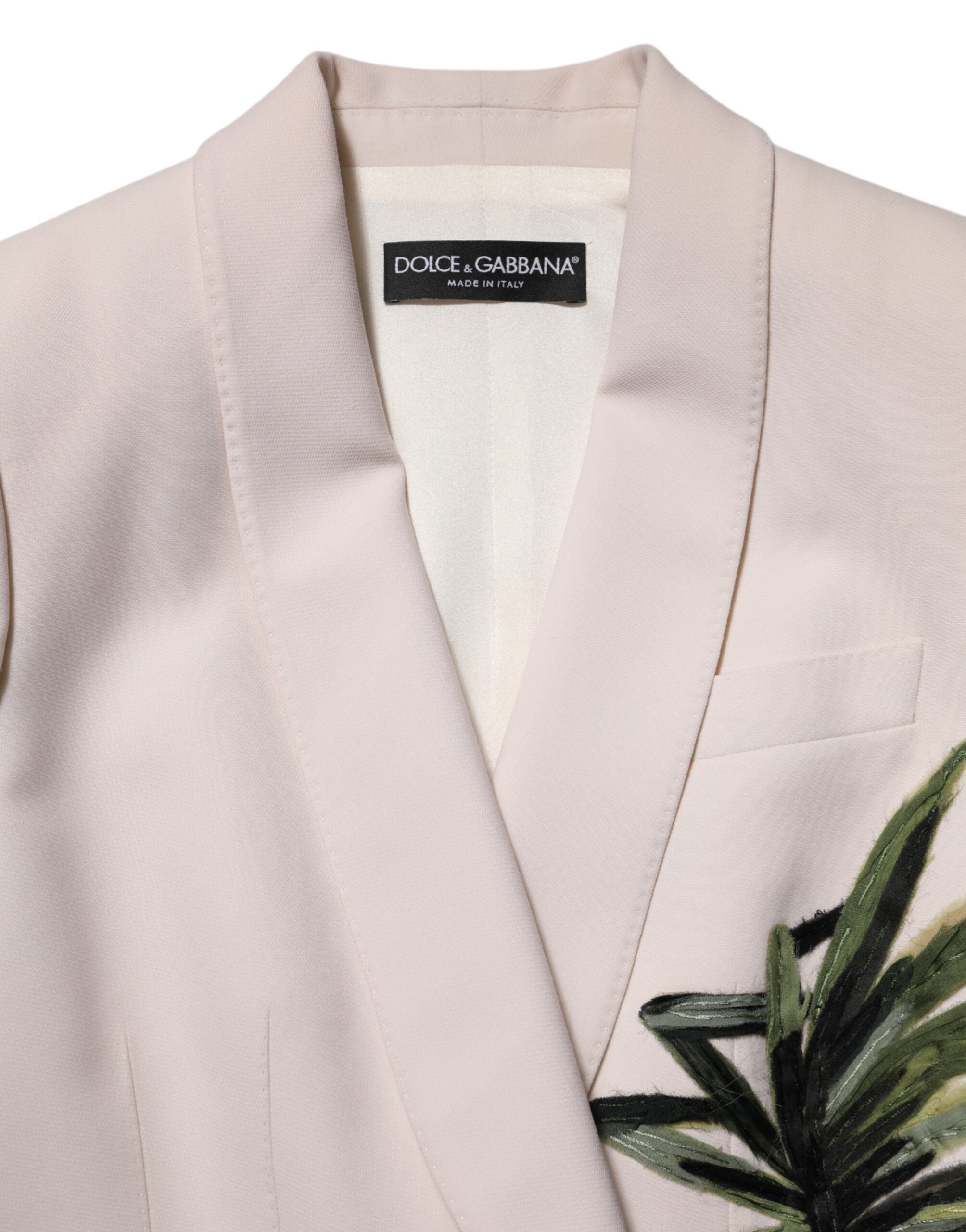 Elevate your wardrobe with the Dolce & Gabbana Beige Embroidered Single Breasted Jacket, a masterpiece of Italian craftsmanship in luxurious wool, perfect for the discerning individual.