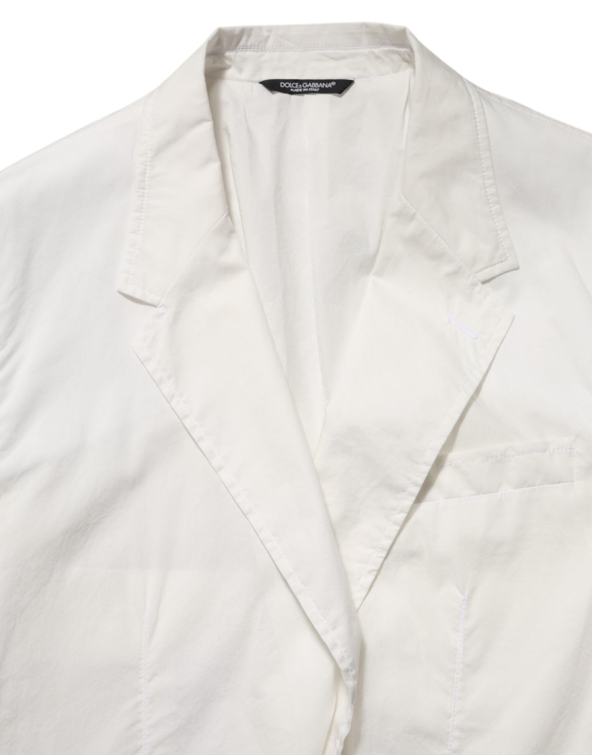 Elevate your wardrobe with the Dolce & Gabbana White Cotton 1 Button Men Suit Blazer, a masterpiece of Italian craftsmanship that embodies timeless elegance and sophistication.