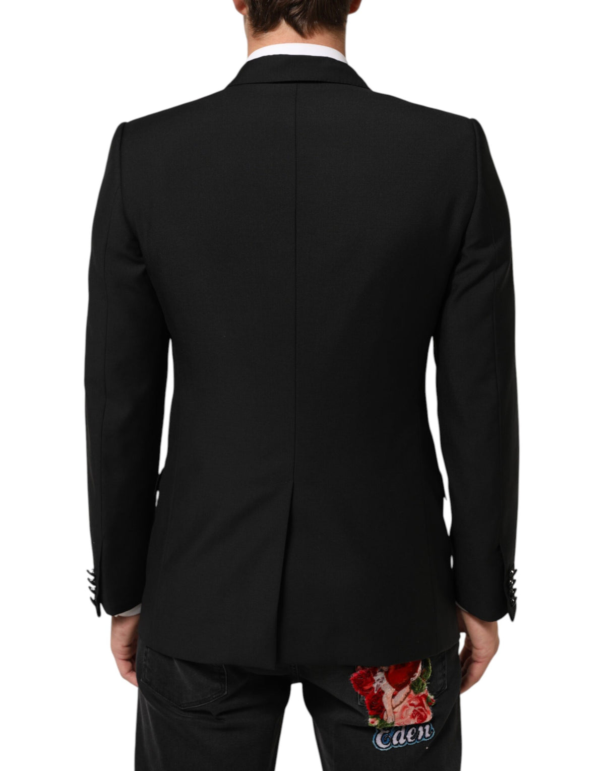 Discover the Dolce & Gabbana Black Wool MARTINI Blazer, a masterpiece of Italian craftsmanship, blending luxury materials for an effortlessly refined silhouette that commands attention.