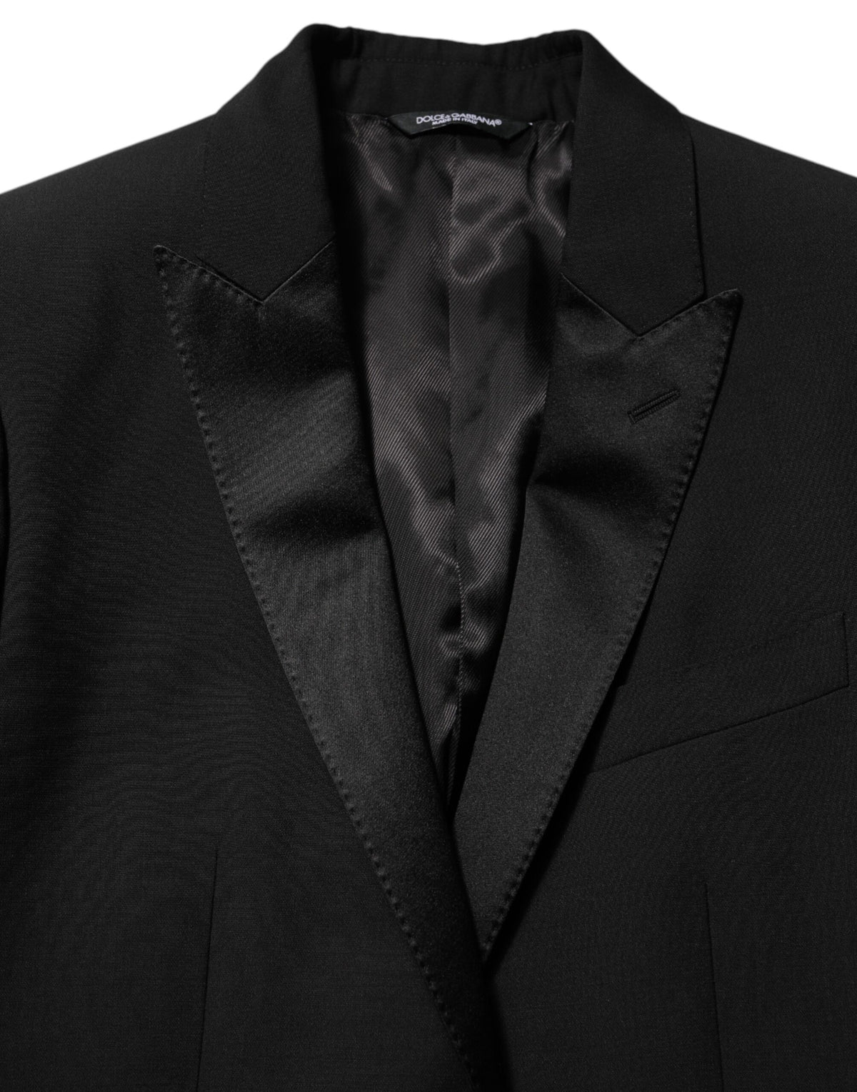 Elevate your style with the Dolce & Gabbana Black Wool MARTINI Blazer, a masterpiece of Italian craftsmanship blending luxury and sophistication for the discerning individual.