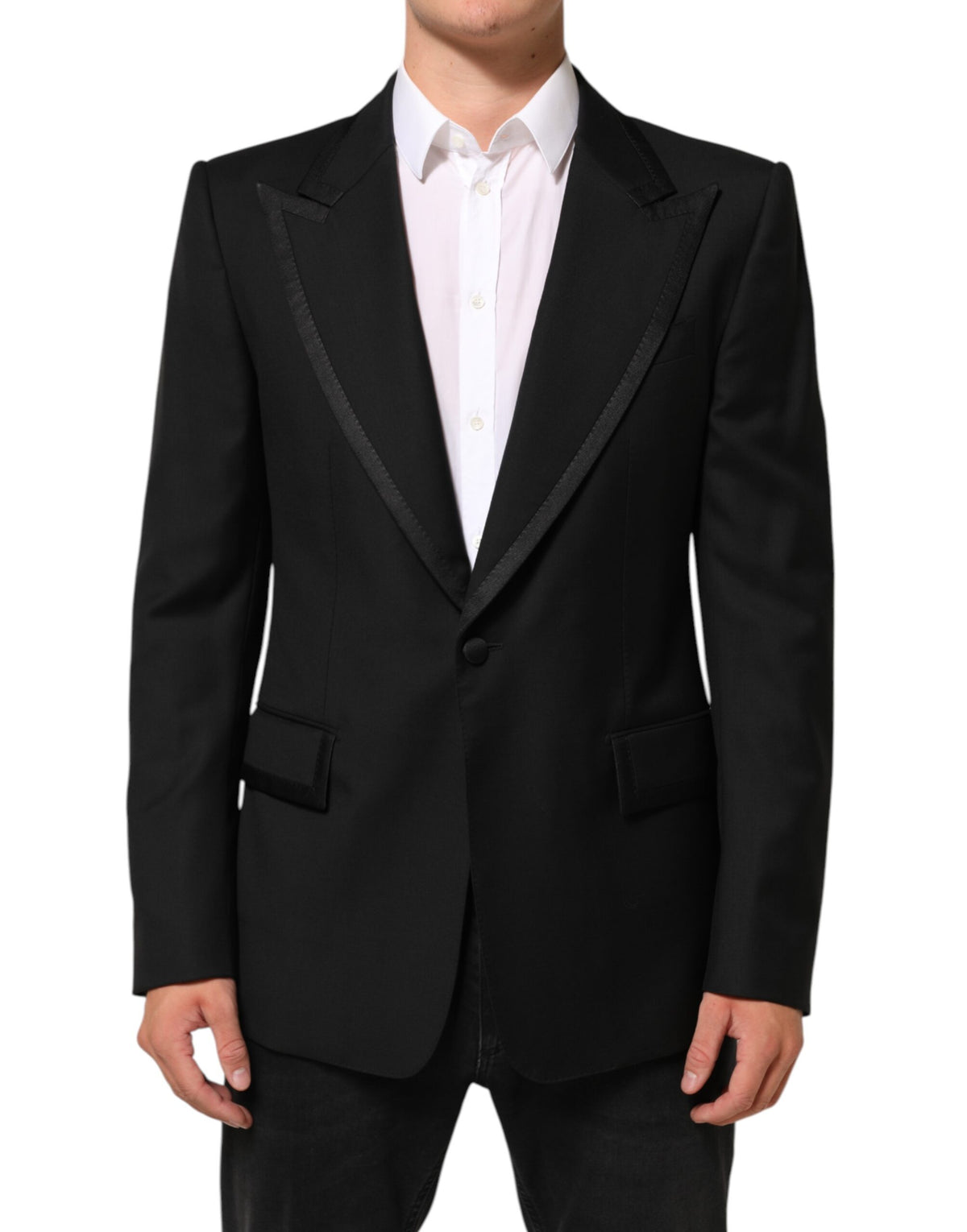 Elevate your wardrobe with the Dolce & Gabbana Black Wool 1 Button Suit Jacket, a masterpiece of Italian craftsmanship that embodies refined luxury and timeless elegance.