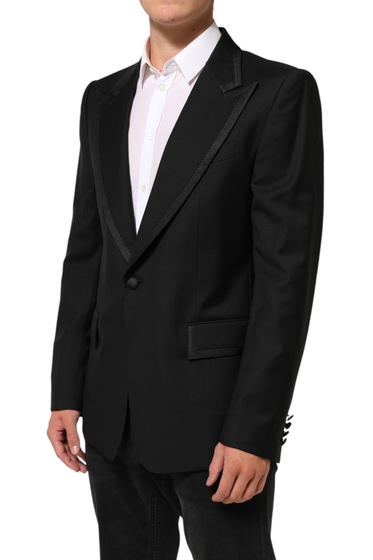 Experience the exquisite craftsmanship of the Dolce & Gabbana Black Wool 1 Button Suit Jacket, a timeless piece that embodies refined luxury and Italian elegance.