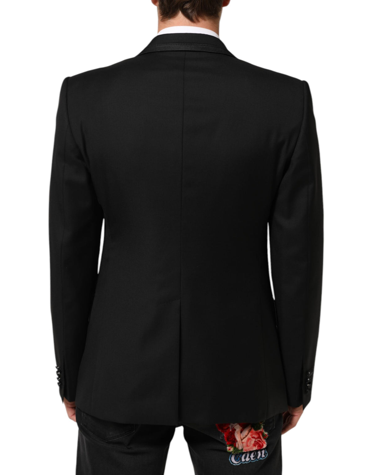 Experience the exquisite craftsmanship of the Dolce & Gabbana Black Wool 1 Button Suit Jacket, a timeless blend of luxury and Italian elegance, perfect for any discerning wardrobe.