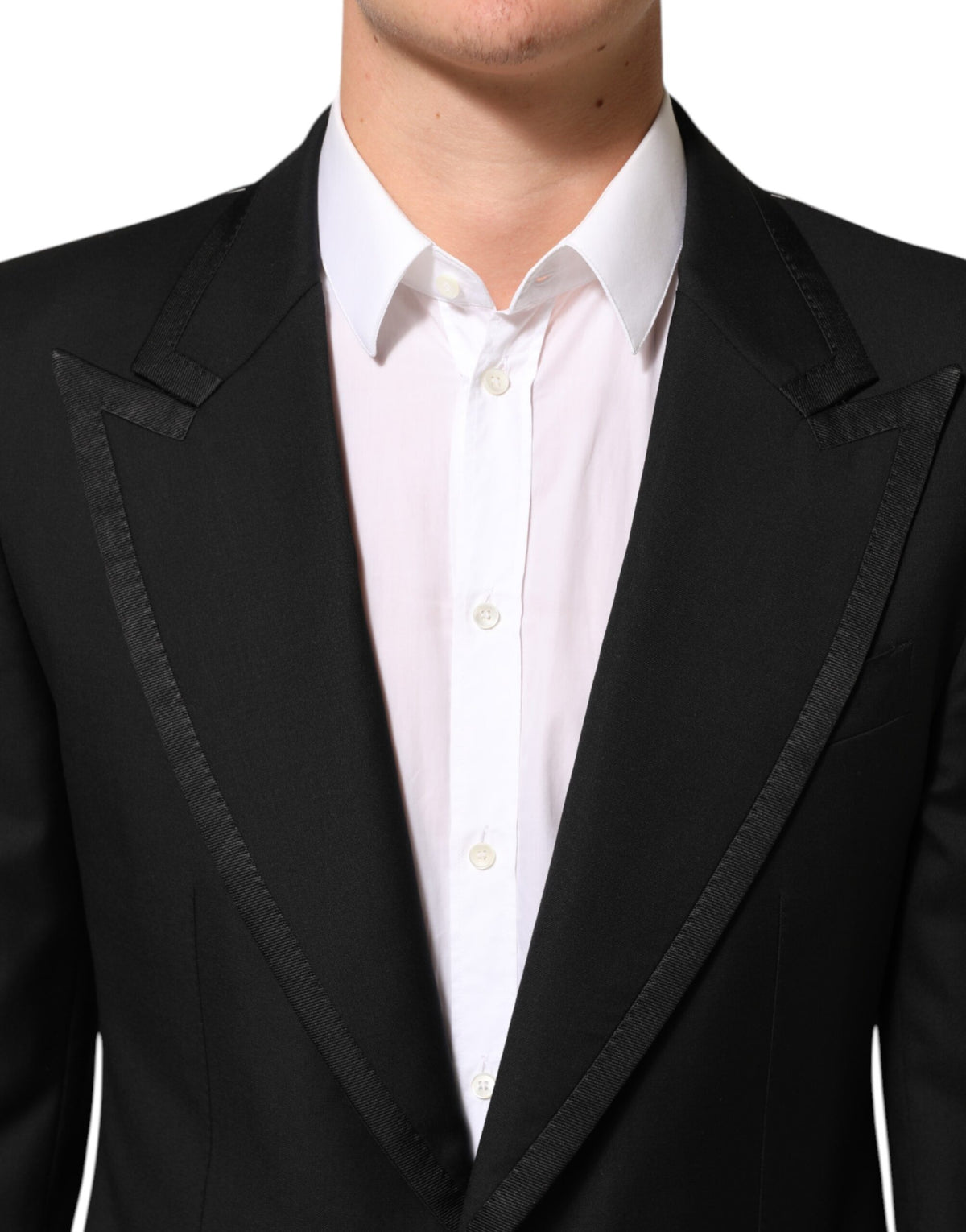 Elevate your wardrobe with the Dolce & Gabbana Black Wool 1 Button Suit Jacket, a masterpiece of Italian craftsmanship, embodying timeless luxury and sophisticated elegance.