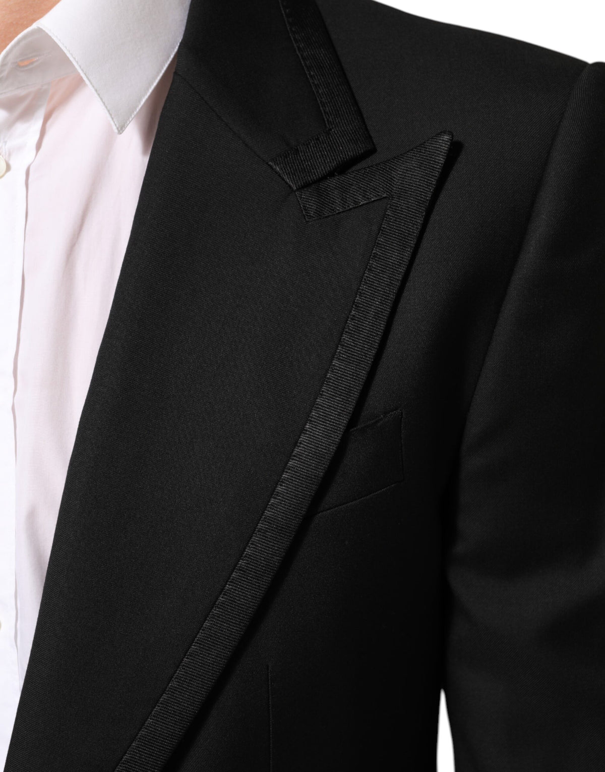 Elevate your wardrobe with the Dolce & Gabbana Black Wool 1 Button Suit Jacket, a masterpiece of Italian craftsmanship that embodies timeless luxury and refined elegance.