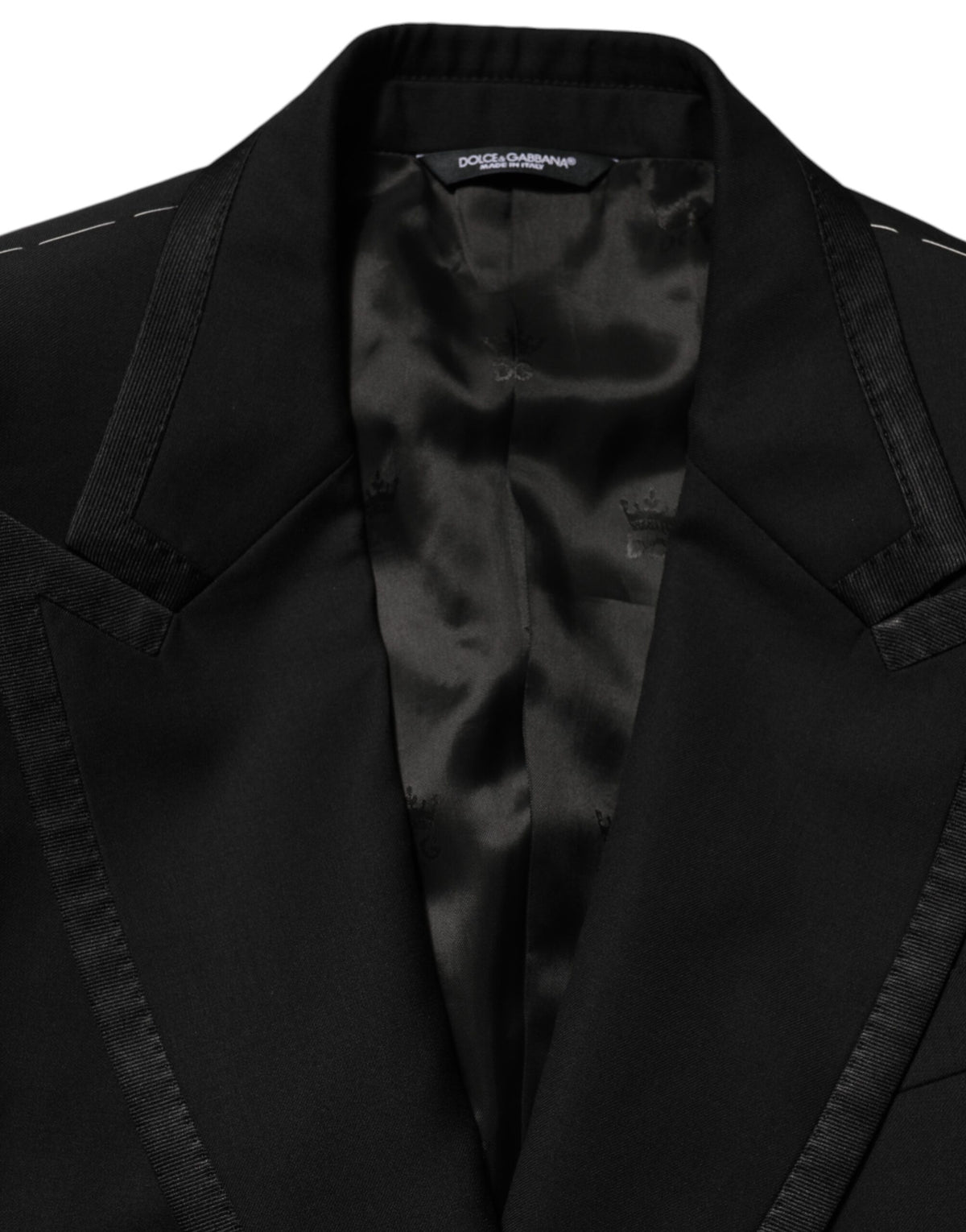 Experience the exquisite Dolce & Gabbana Black Wool 1 Button Suit Jacket, a timeless blend of luxury and Italian craftsmanship, perfect for the discerning individual.