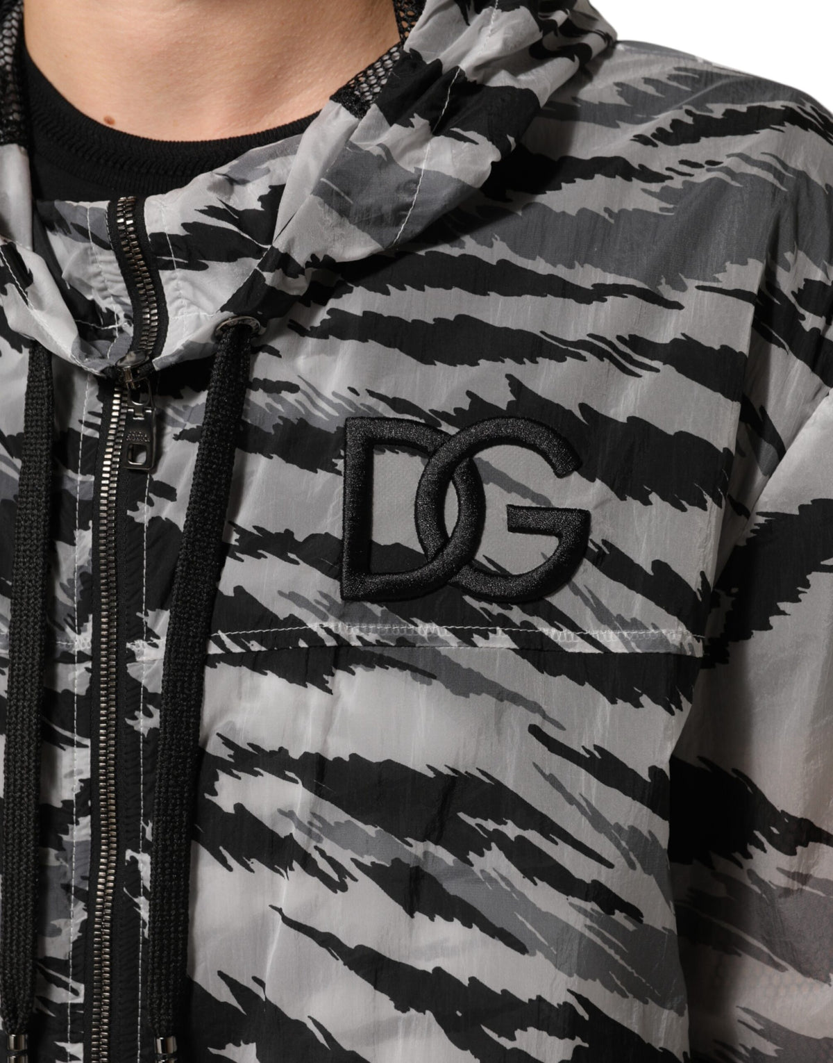 Indulge in the Dolce & Gabbana Gray Camouflage Hooded Sweatshirt Jacket, a luxurious blend of urban elegance and Italian craftsmanship, perfect for the discerning fashionista.