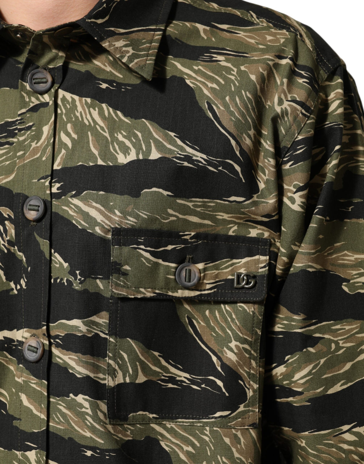 Elevate your wardrobe with the Dolce & Gabbana Multicolor Camouflage Cotton Casual Shirt, a masterpiece of Italian craftsmanship that embodies bold elegance and timeless allure.