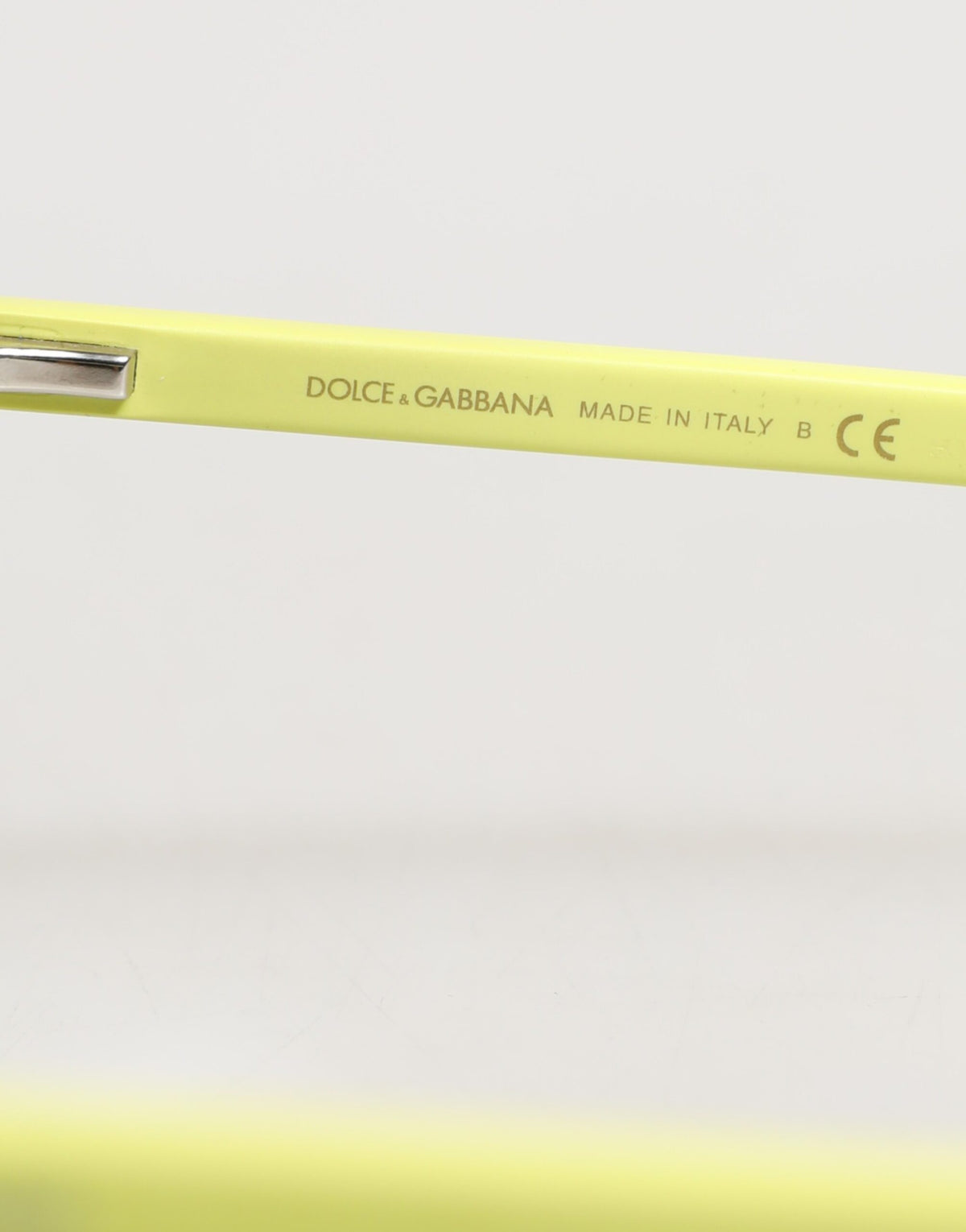 Indulge in the allure of Dolce & Gabbana DG4324 sunglasses, where bold yellow frames meet exquisite Italian craftsmanship, embodying timeless elegance and luxury.