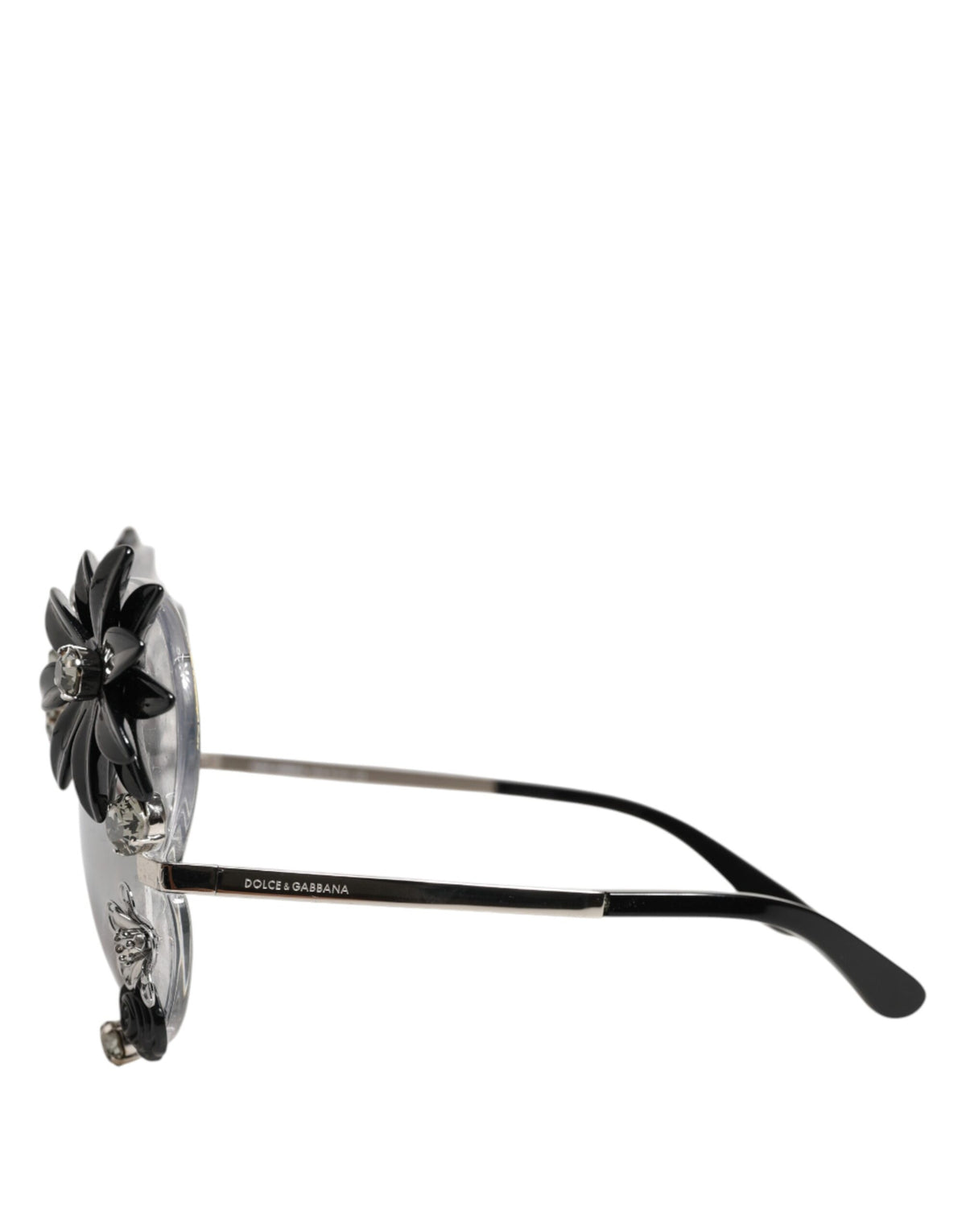 Indulge in the exquisite artistry of Dolce & Gabbana's Transparent DG4292 Round Crystal Flowers Sunglasses, where handcrafted elegance meets timeless luxury for the discerning individual.