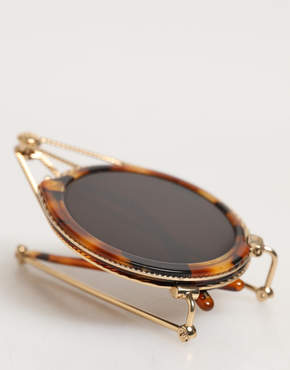 Indulge in the exquisite Dolce & Gabbana Gold Havana Frame DG Fatto A Mano Sunglasses, where Italian craftsmanship meets timeless elegance for the discerning connoisseur.