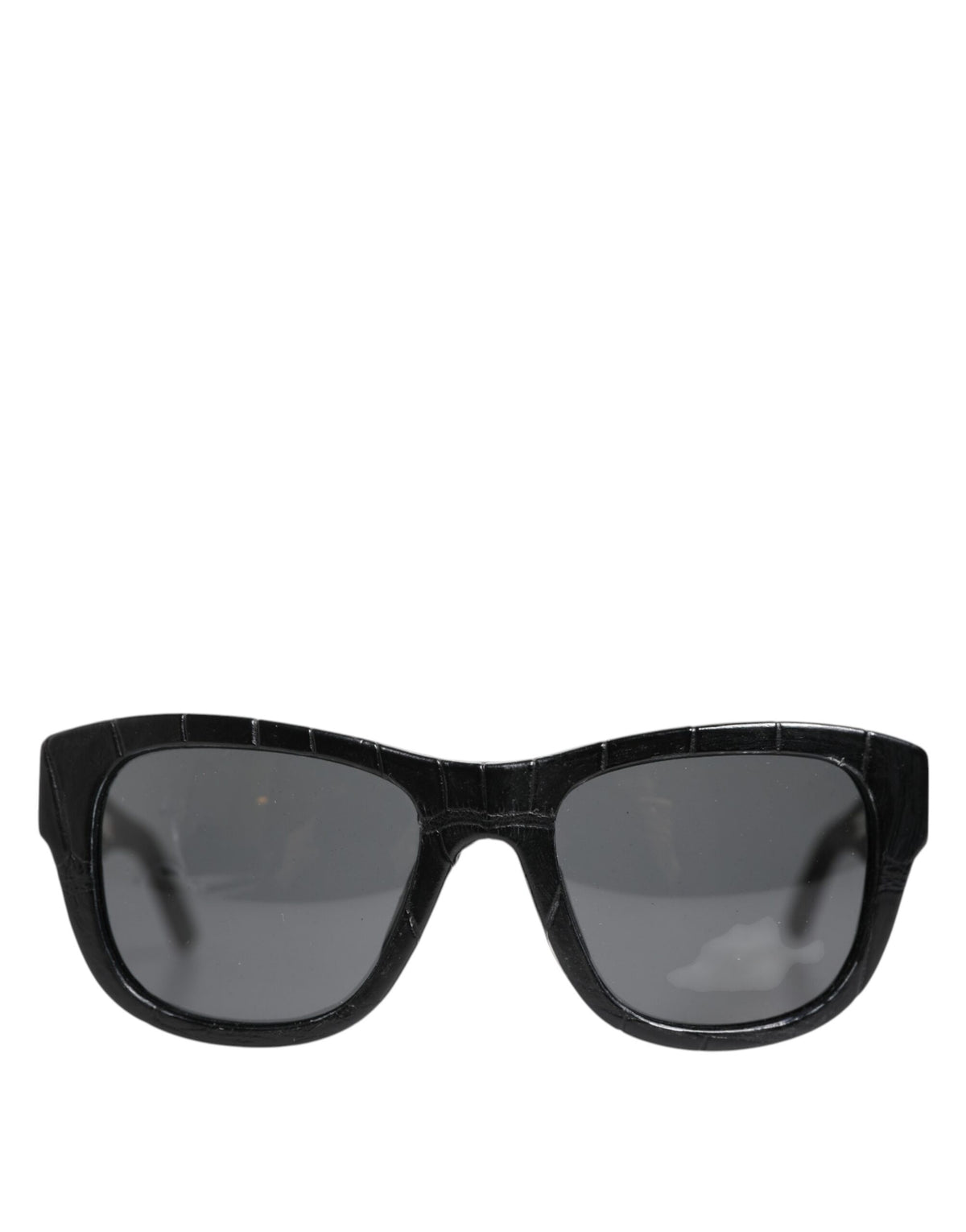 Indulge in the exquisite allure of Dolce & Gabbana DG4177 sunglasses, crafted from luxurious alligator leather, embodying timeless elegance and confident sophistication.