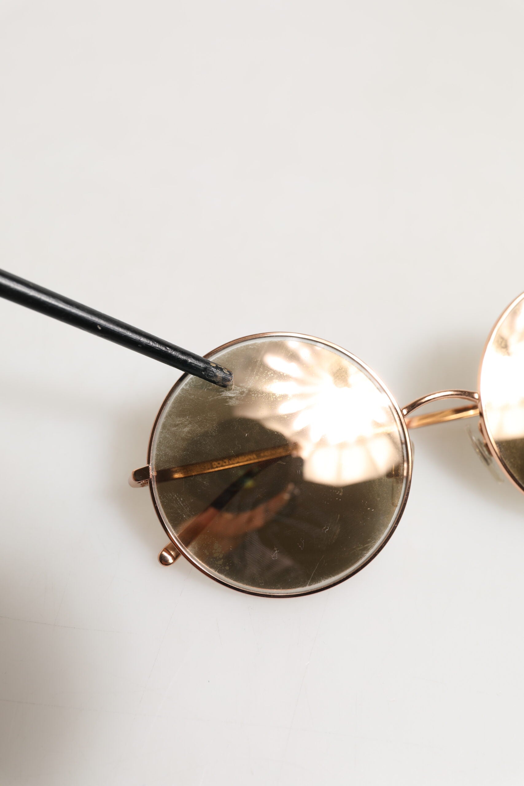 Experience the allure of Dolce & Gabbana DG2215K Gold Metal Round Shades, where exquisite craftsmanship meets timeless elegance, perfect for the discerning individual.