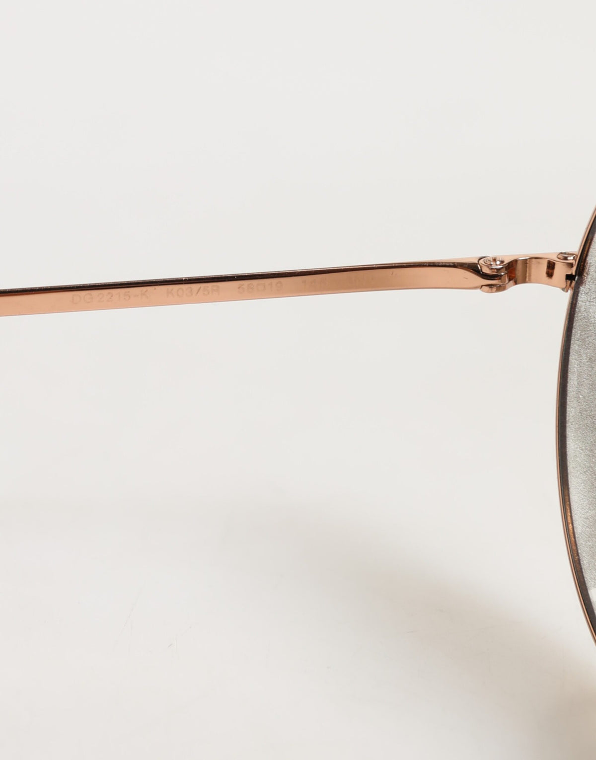 Experience the allure of Dolce & Gabbana DG2215K Gold Metal Round Shades, a luxurious accessory that embodies elegance and sophistication for the discerning individual.