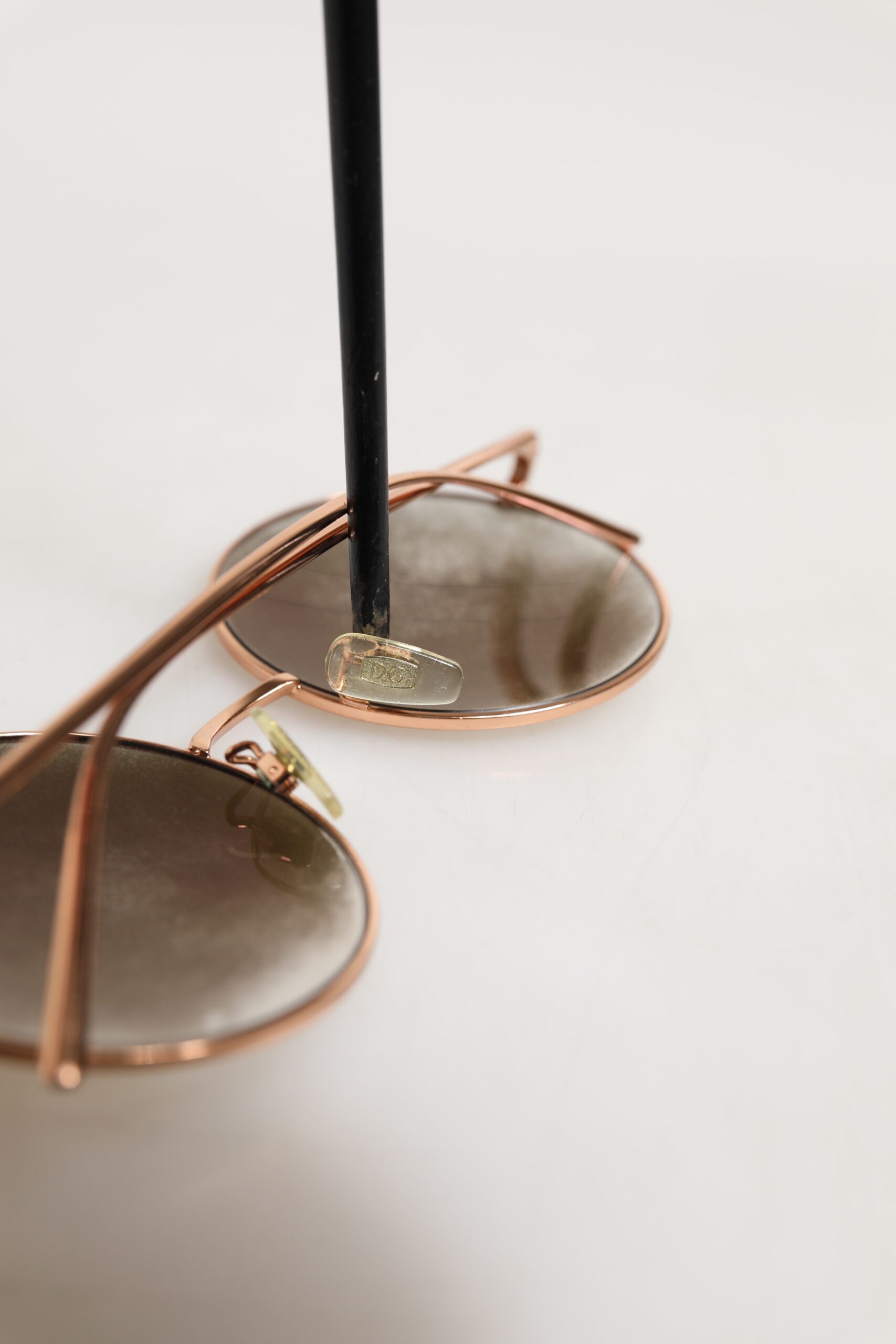 Elevate your style with Dolce & Gabbana DG2215K Gold Metal Round Shades, a timeless luxury accessory that embodies sophistication and modern elegance.