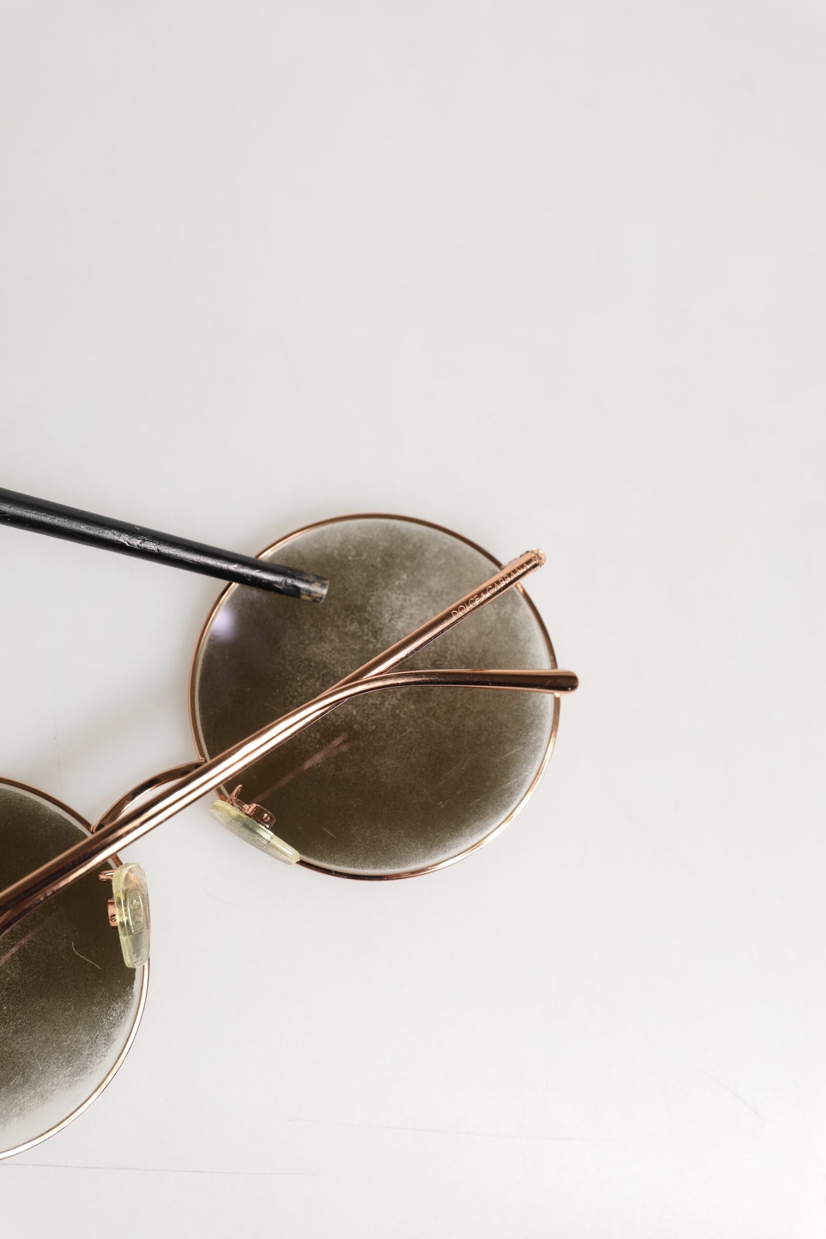 Elevate your style with Dolce & Gabbana DG2215K Gold Metal Round Shades, a symbol of luxury and sophistication, expertly crafted for the discerning individual.