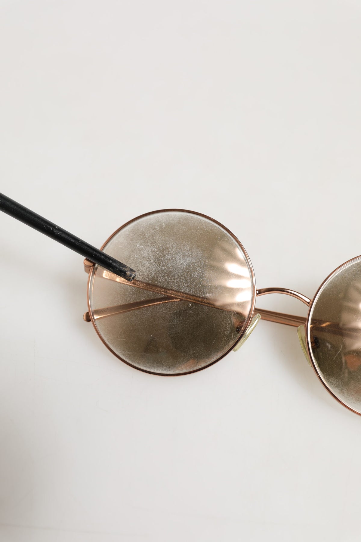 Elevate your style with the Dolce & Gabbana DG2215K Gold Metal Round Shades, a luxurious accessory that embodies timeless elegance and sophisticated allure.