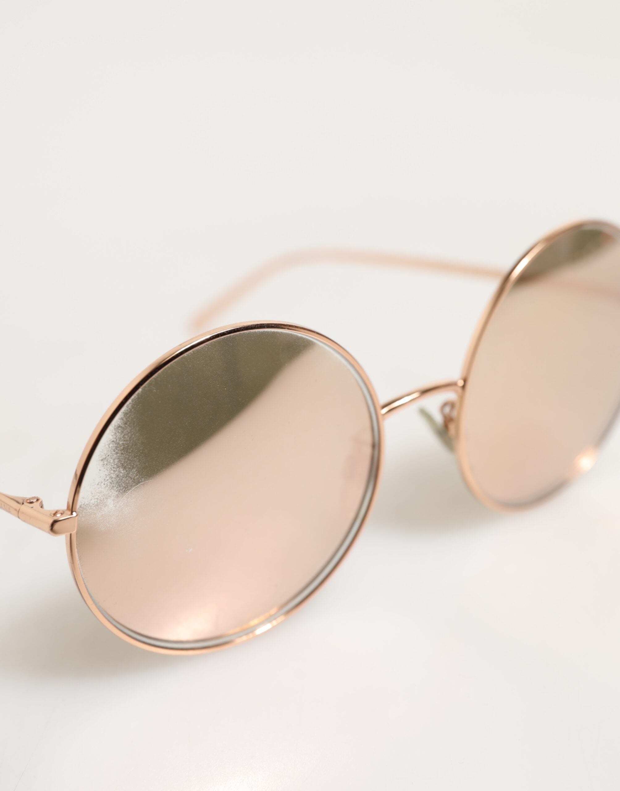 Indulge in the exquisite Dolce & Gabbana DG2215K Gold Metal Round Shades, where timeless elegance meets Italian craftsmanship, elevating your luxurious lifestyle.