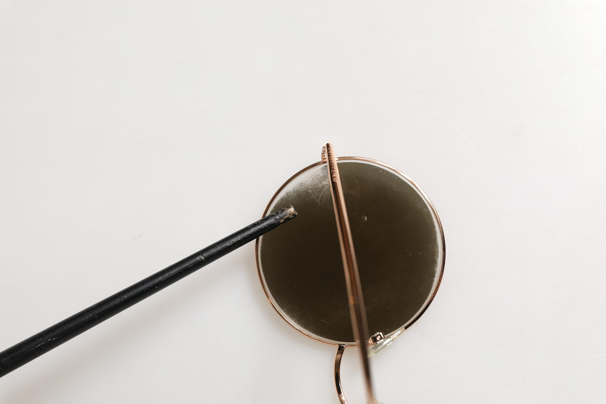 Indulge in the opulent allure of Dolce & Gabbana DG2215K Gold Metal Round Shades, where exquisite craftsmanship meets timeless elegance, perfect for the discerning connoisseur.
