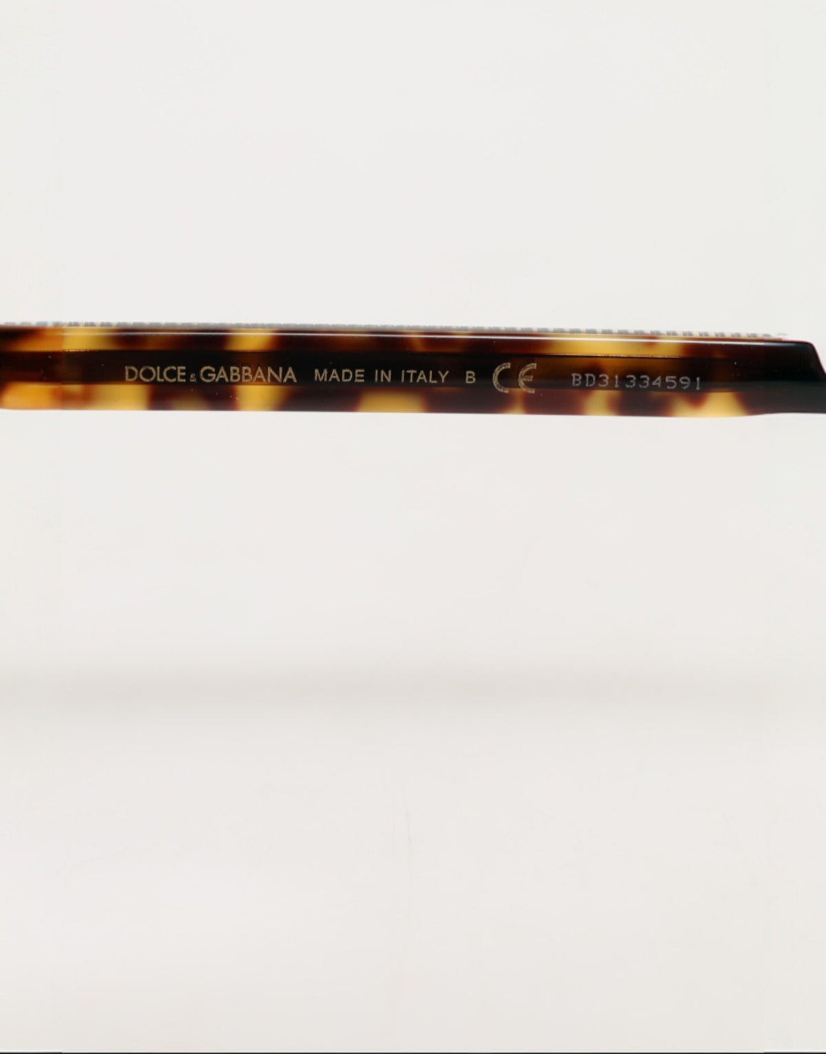 Experience the allure of Dolce & Gabbana's Dark Brown Tortoise Shell Pilot Frame Sunglasses, where exquisite Italian craftsmanship meets timeless elegance for the discerning individual.