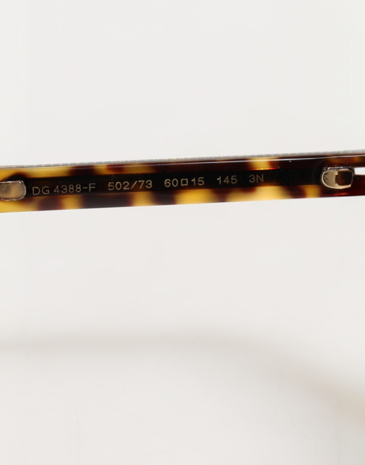 Elevate your style with Dolce & Gabbana's Dark Brown Tortoise Shell Pilot Frame Sunglasses, a timeless blend of exquisite craftsmanship and luxurious allure, perfect for any occasion.