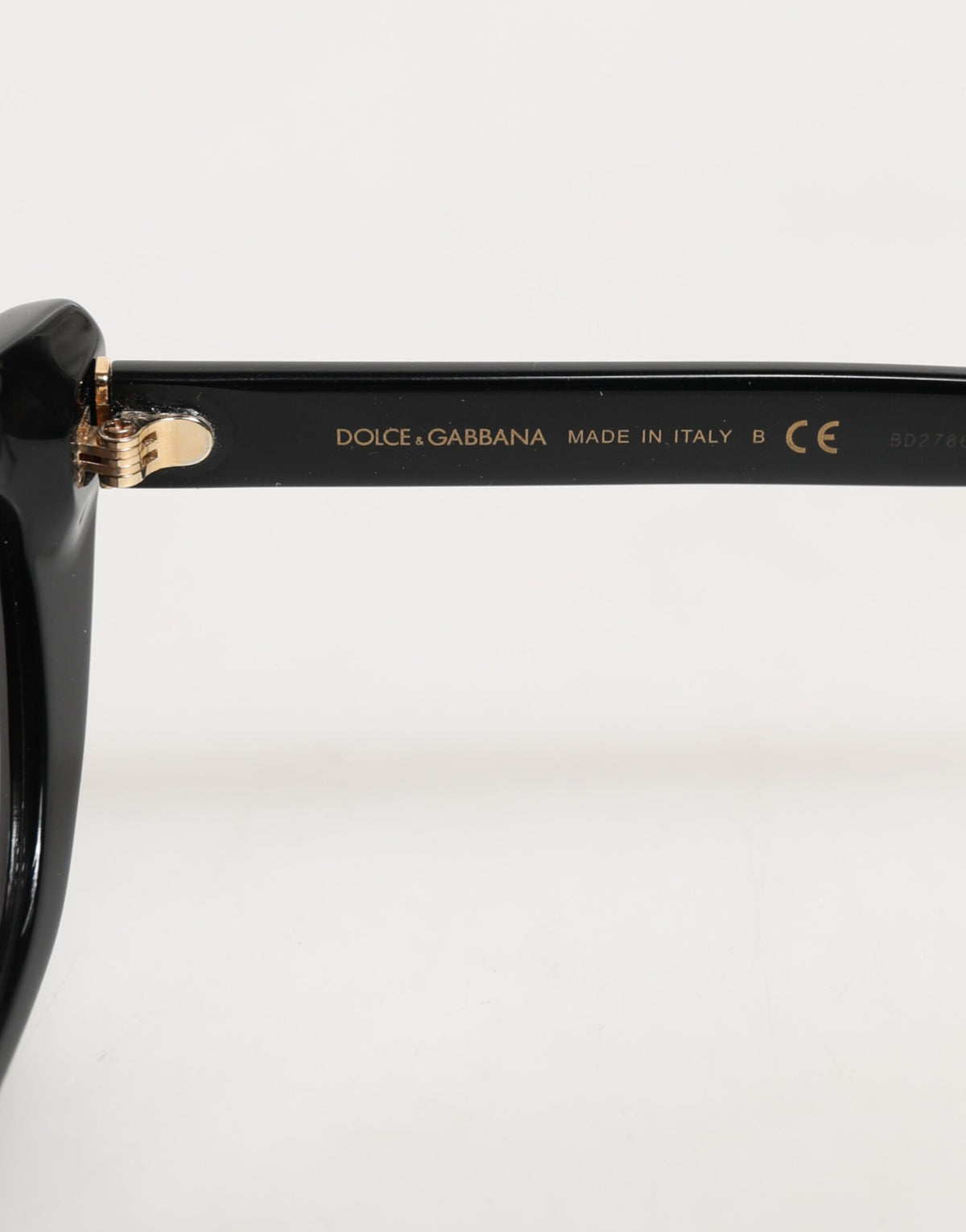 Discover the allure of Dolce & Gabbana's Black Re-Edition DNA Cat-Eye Frame Sunglasses, where exquisite Italian craftsmanship meets timeless elegance, perfect for the discerning individual.
