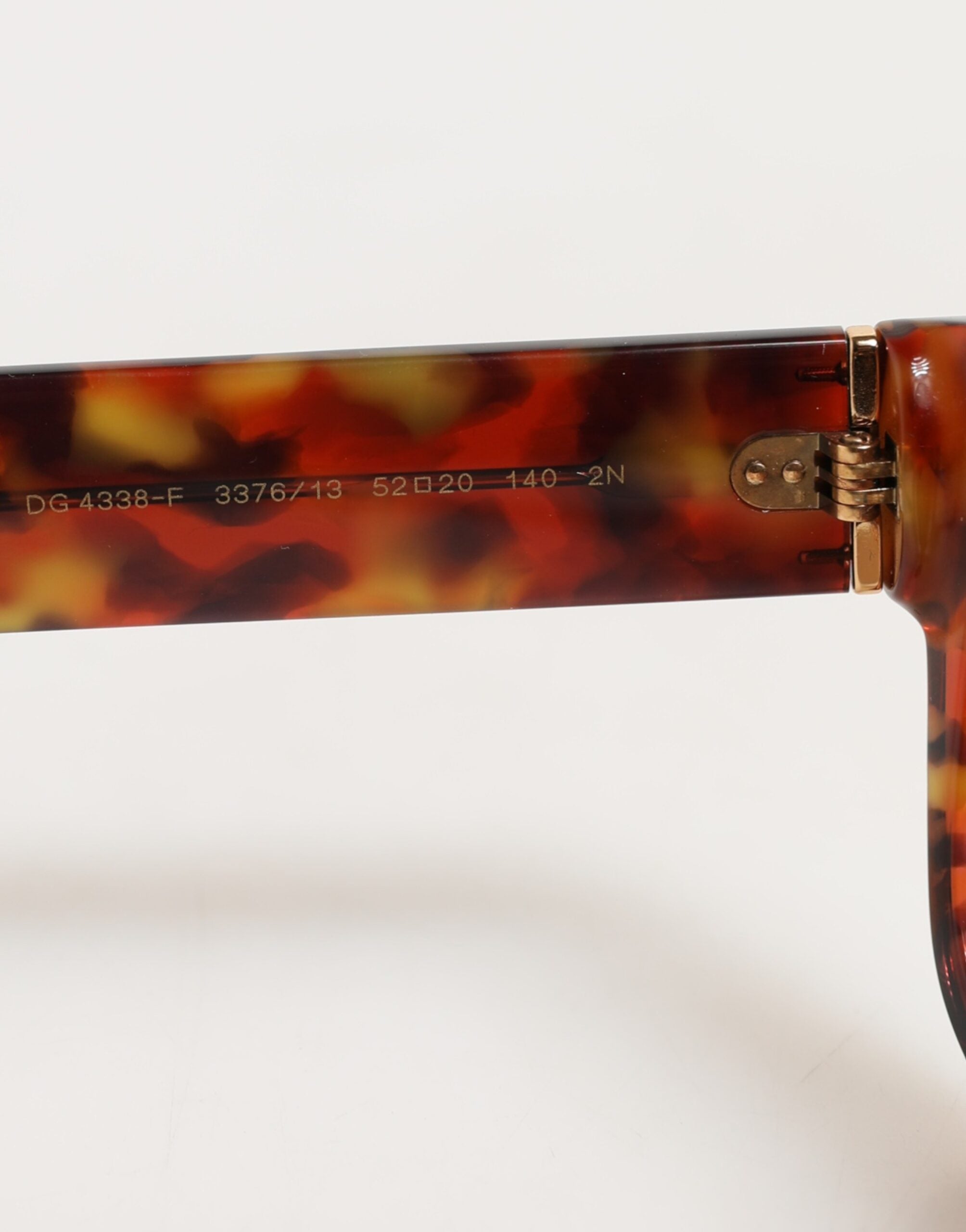 Indulge in the exquisite Dolce & Gabbana DG4338F sunglasses, where luxurious craftsmanship meets timeless elegance, perfect for the discerning individual who embodies sophistication.