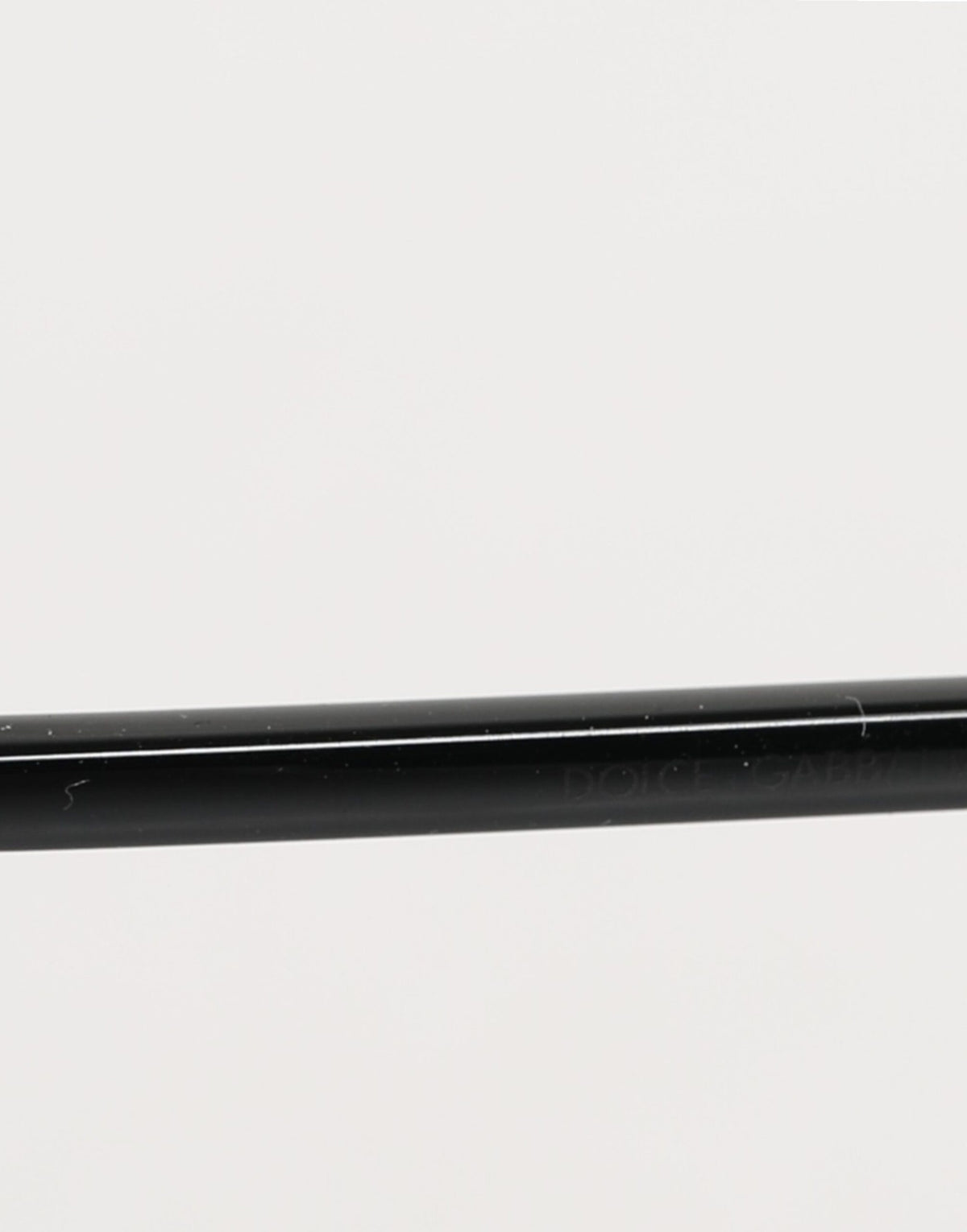 Experience the allure of Dolce & Gabbana's Black Metal Frame Square Lenses Sunglasses, where exquisite craftsmanship meets timeless elegance for the discerning individual.