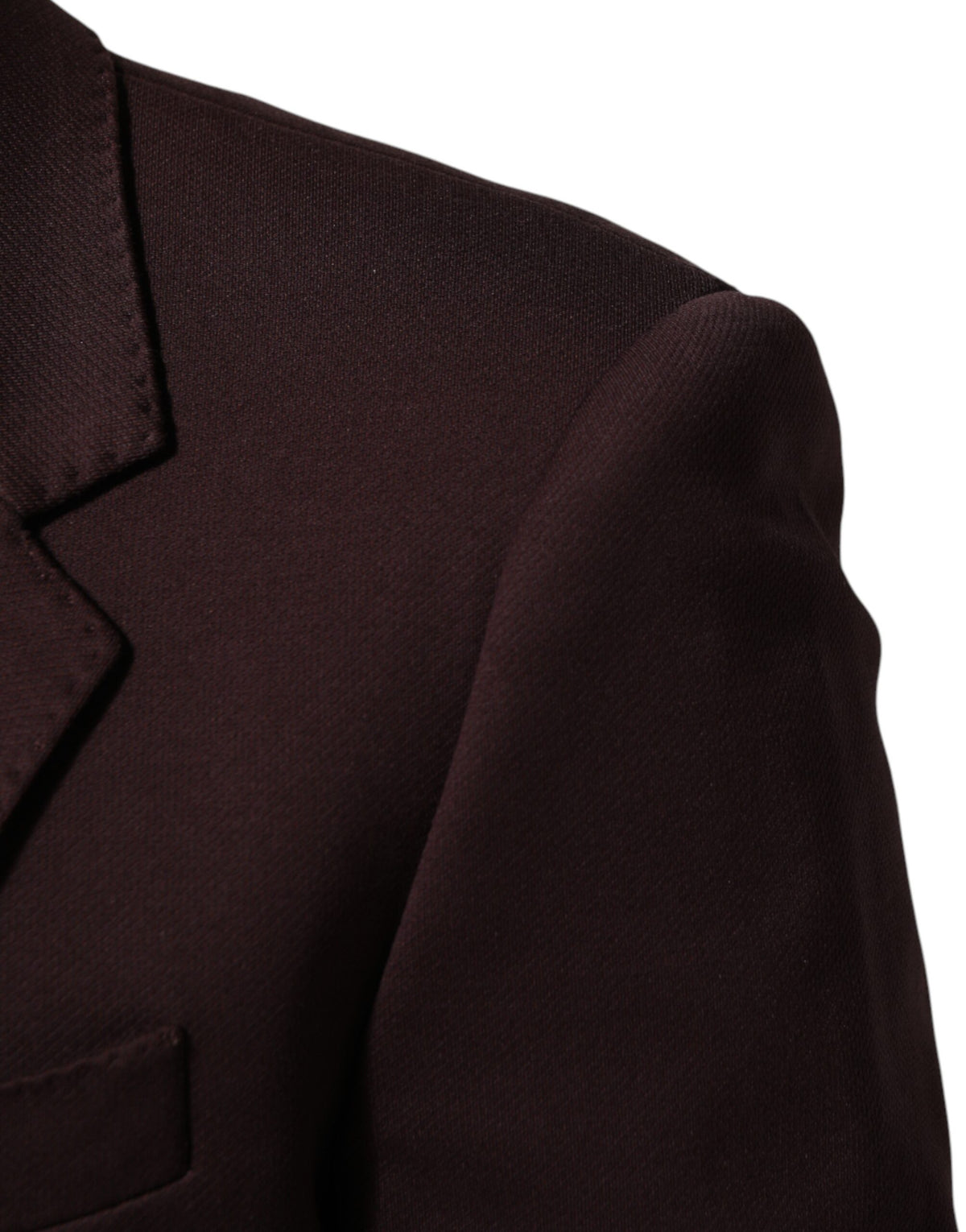 Elevate your wardrobe with the Dolce & Gabbana Maroon Cotton Blazer, a masterpiece of Italian craftsmanship that embodies timeless elegance and sophisticated allure.