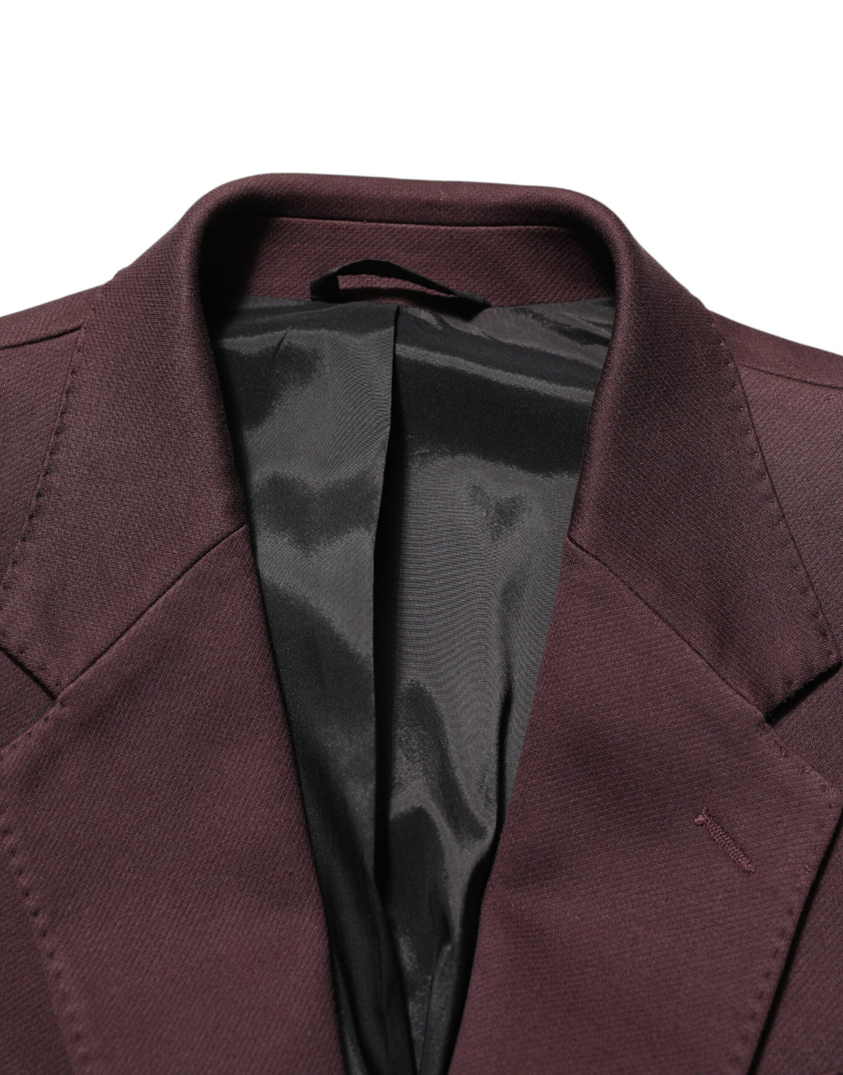Elevate your wardrobe with the Dolce & Gabbana Maroon Cotton Blazer, a timeless masterpiece of Italian craftsmanship, designed for those who embody elegance and confidence.