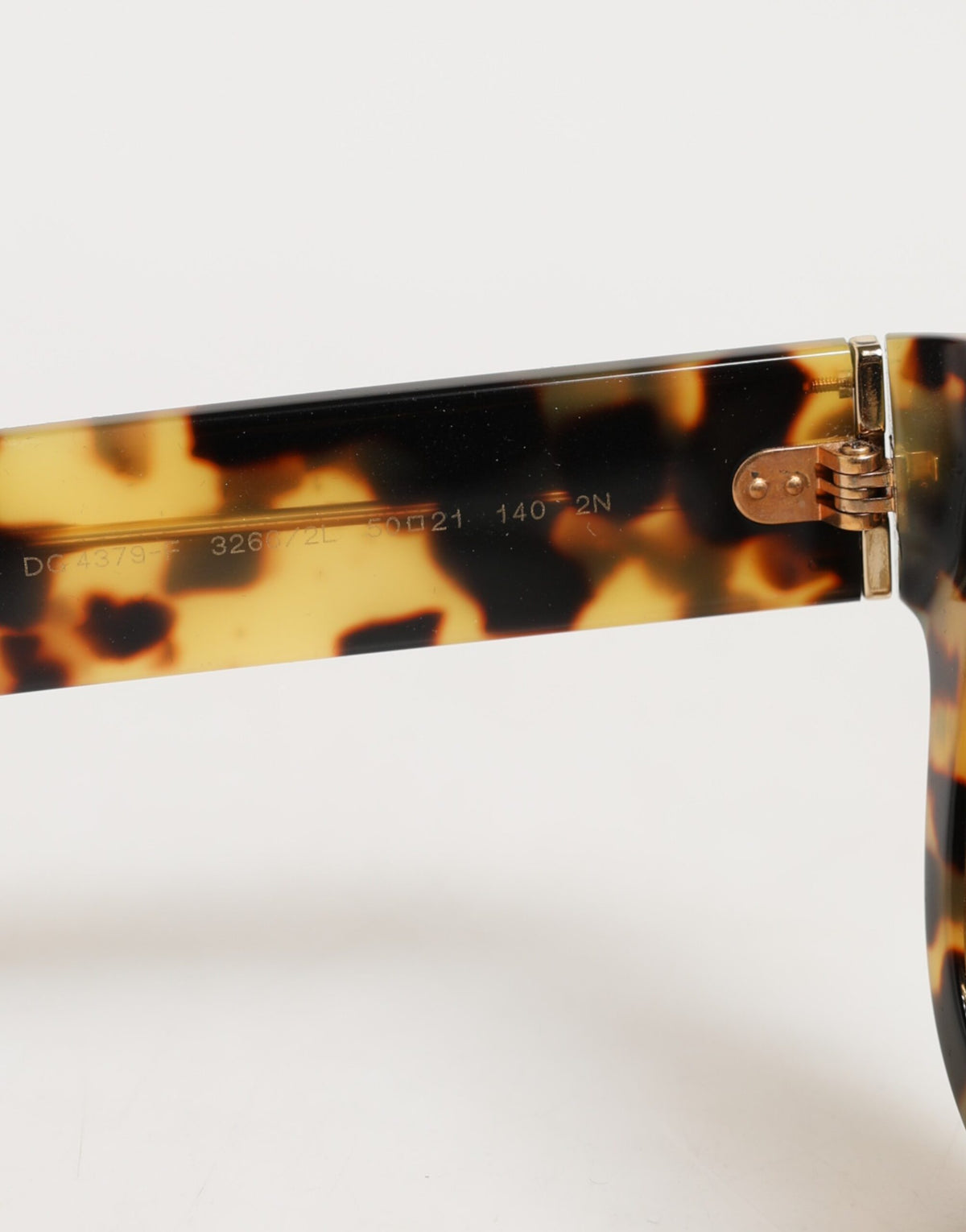 Indulge in the exquisite Dolce & Gabbana DG4379F sunglasses, crafted from premium Italian acetate, embodying elegance and sophistication for the discerning individual.