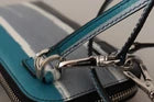Elevate your style with the Dolce & Gabbana Blue Leather Cross Body Neck Strap Phone Pocket, a masterpiece of Italian craftsmanship that embodies luxury and versatility.